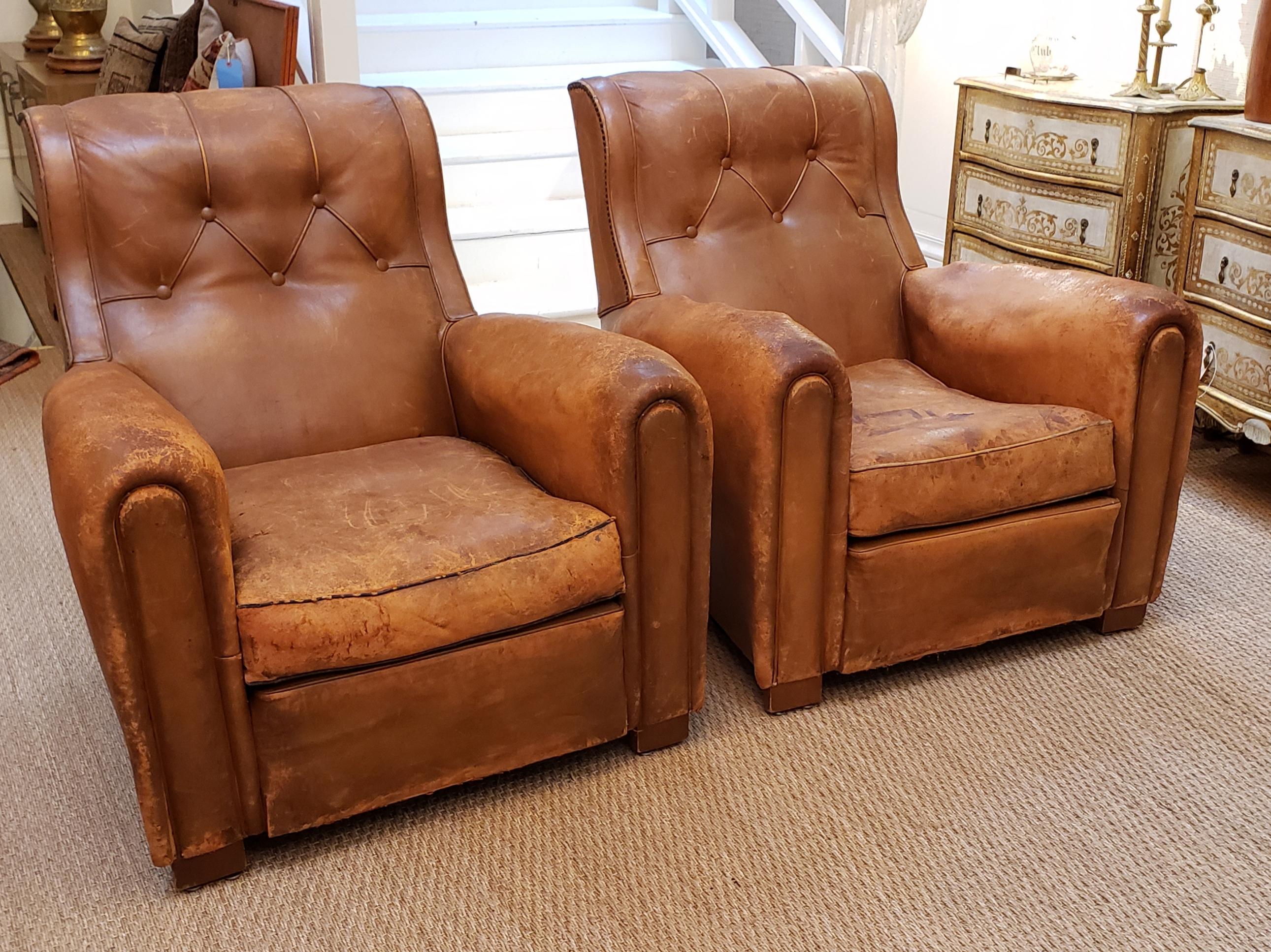 A fantastic pair of Art Deco leather club chairs. Having a beautiful warm patina these chairs are inviting to anybody who sees them. And their inclined backs make them a wonderful fireside accessory.
Being sold only as the pair.