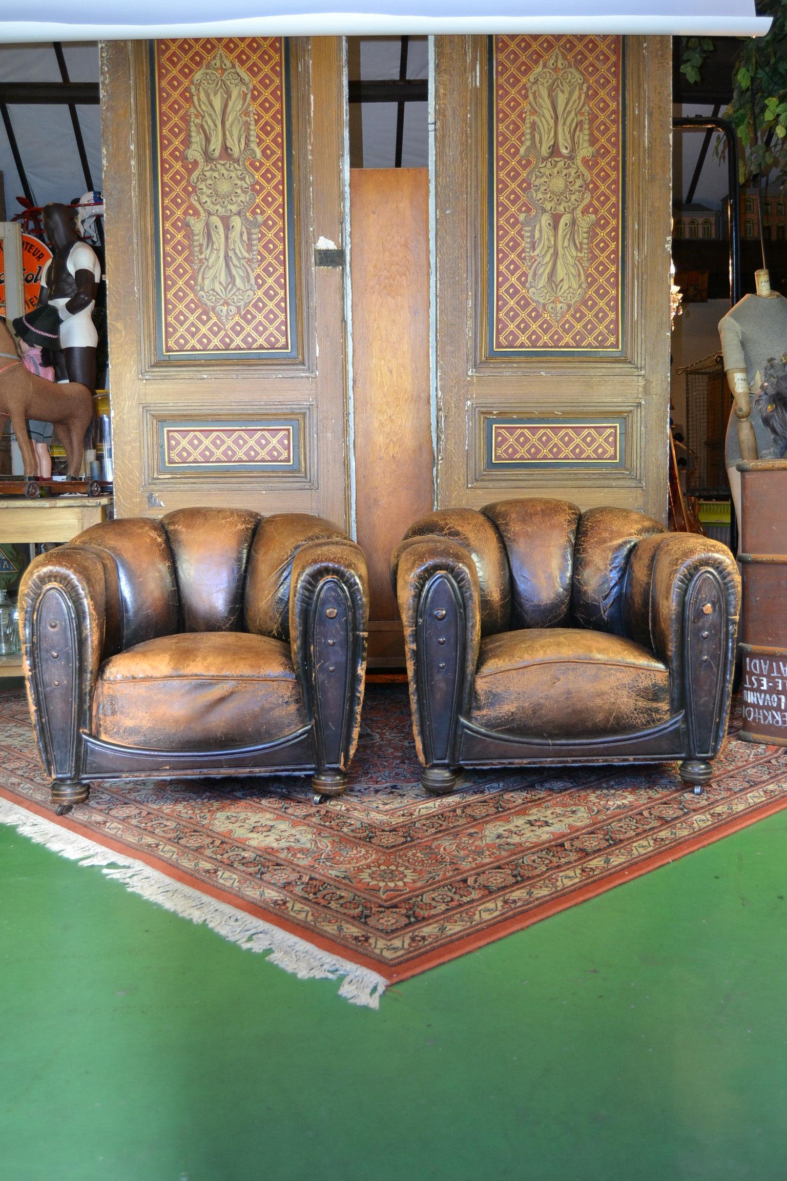 Antique Art Deco Brown Leather Club Chairs  - Armchairs with Great Aged Patina.
Vintage Club Chairs - Cigar Arm Moustache Chairs with rounded seat backs and also leather fronts.
These stylish club chairs have a great shape due his Shell Back and
