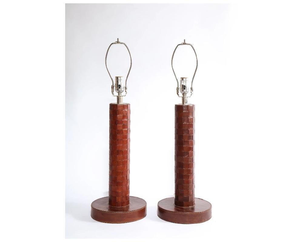 Pair of Art Deco Leather Lamps Attributed to Paul Dupré-Lafon For Hermes

Unsigned in good condition with minor scuffs to the leather consistent with age.

Ready to use comes wired

Size: 21 inches high base is approximately 8 ½ inches wide

Due to