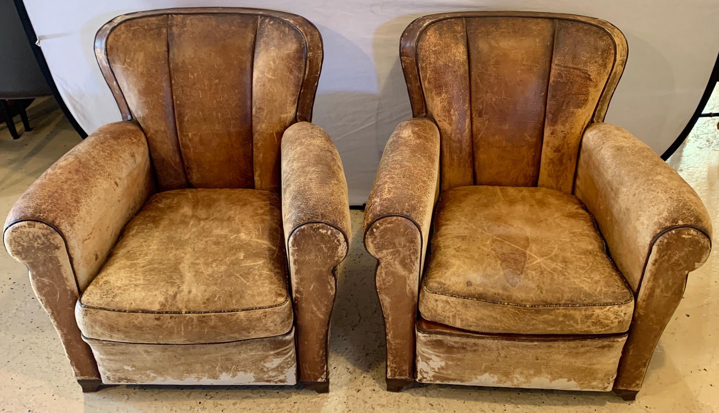 Pair of Art Deco leather lounge chairs, circa 1940s. These finely constructed and worn leather lounge or club chairs in the Art Deco manner have been recently re wired. These chair are very structurally sound.

Greg

hxx.