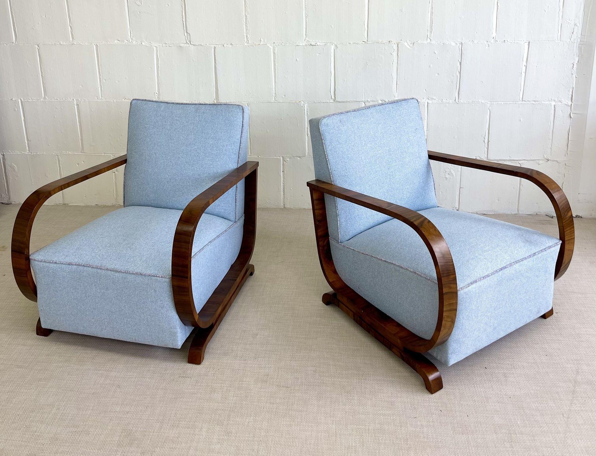 Pair of Art Deco lounge chairs, walnut, fabric, Sweden, Early 20th Century
 
Pair of early 20th century Art Deco lounge chairs by an unknown Swedish designer. This low profile pair of arm chairs has a walnut frame and later upholstery in good
