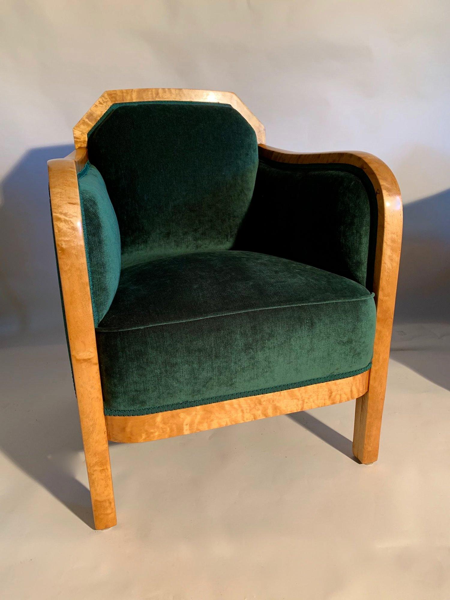 Pair of Swedish Art Deco flame birch lounge chairs.
These chairs have been re upholstered in a beautiful emerald green chenille fabric which is a perfect compliment to the timber.
The seats are fully sprung and very comfortable.
  