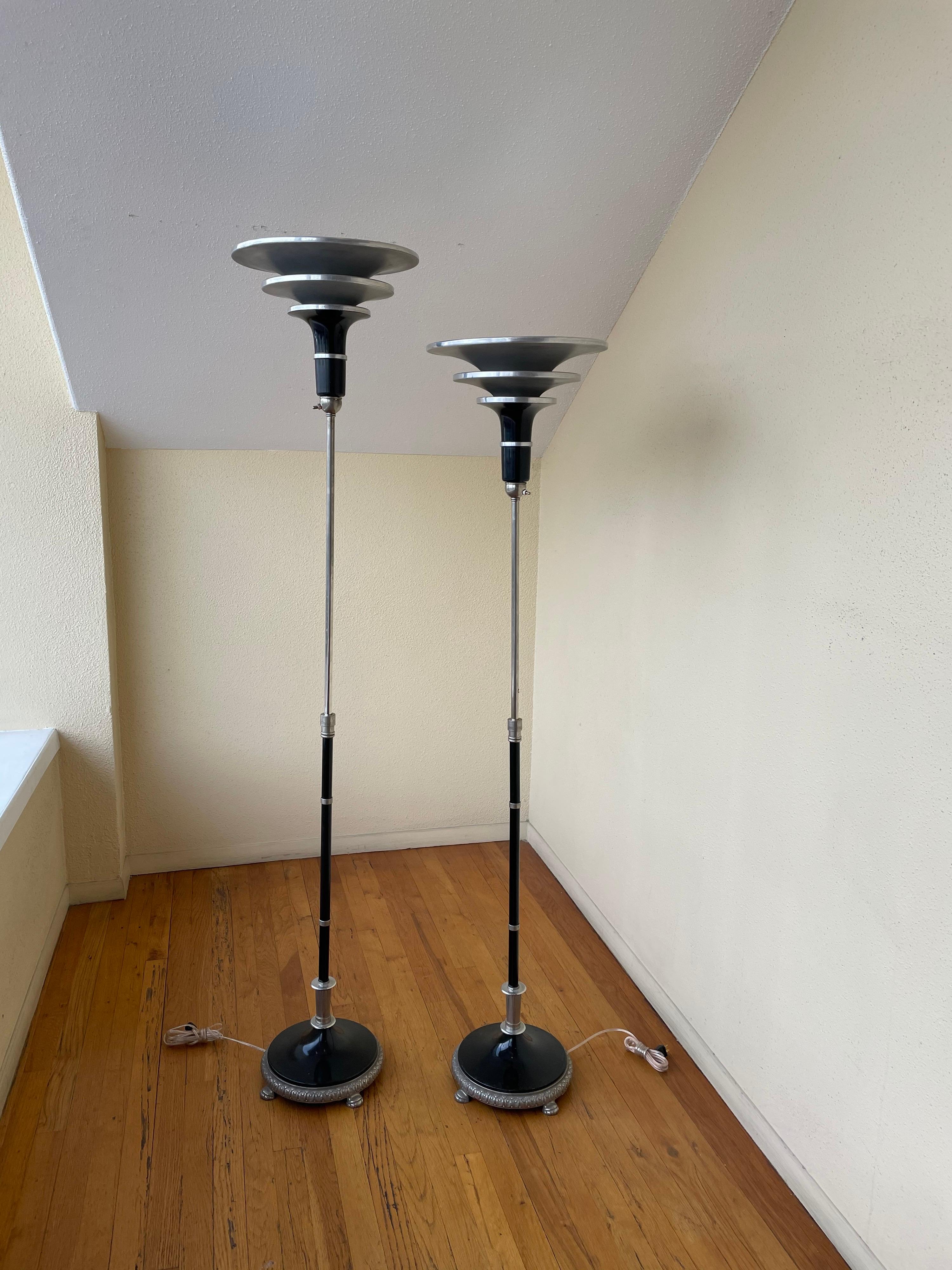 Nice pair of torchiere Art deco lamps freshly rewired, nice aluminum shades the lamps move up and down, a very rare and hard to find pair in its original condition. The lamps move from 57