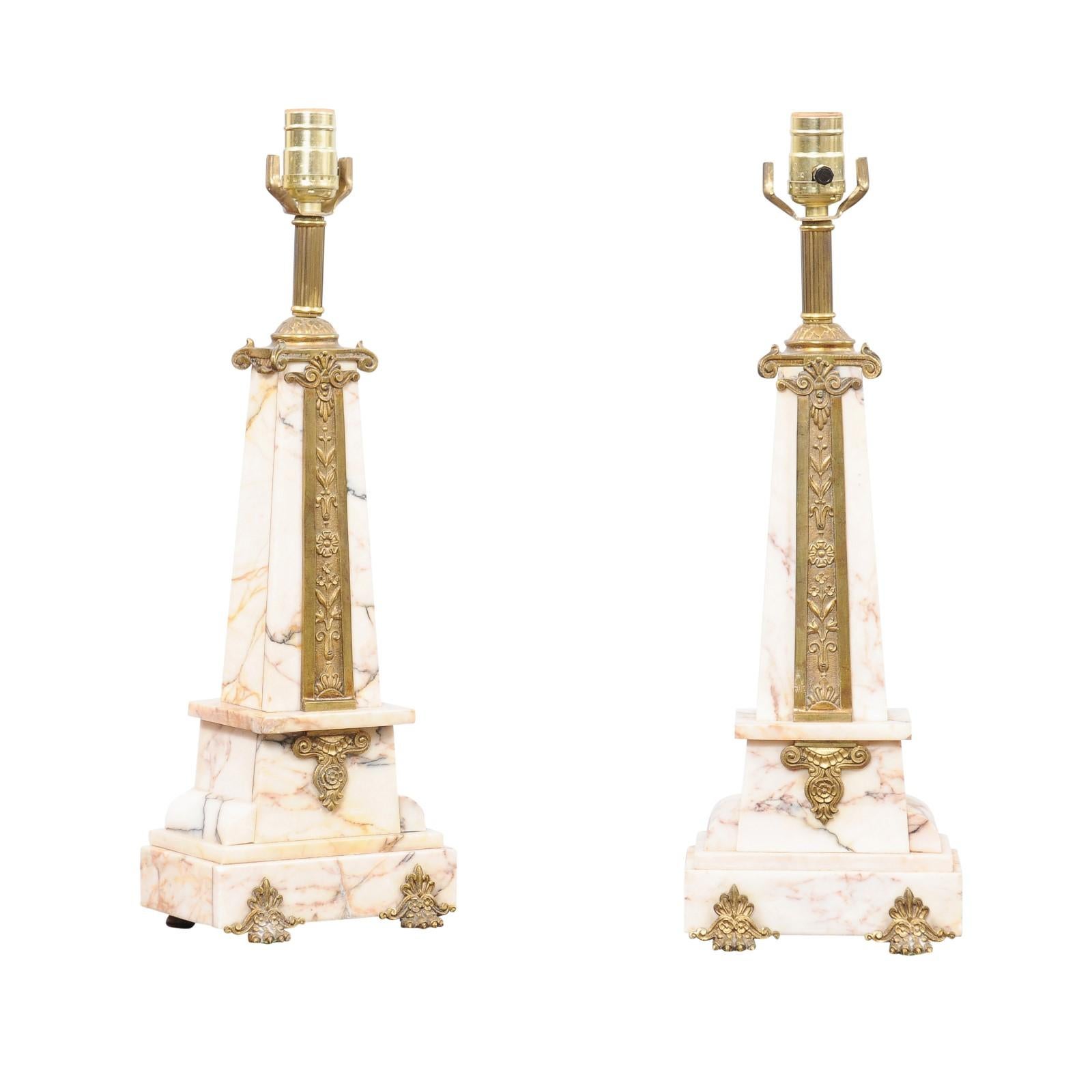 Pair of Art Deco Marble Lamps with Gilt Bronze Mounts, ca. 1920

29.25″ H (to finial) X 19.5″ H (to socket) X 6.5″ W X 5″ D