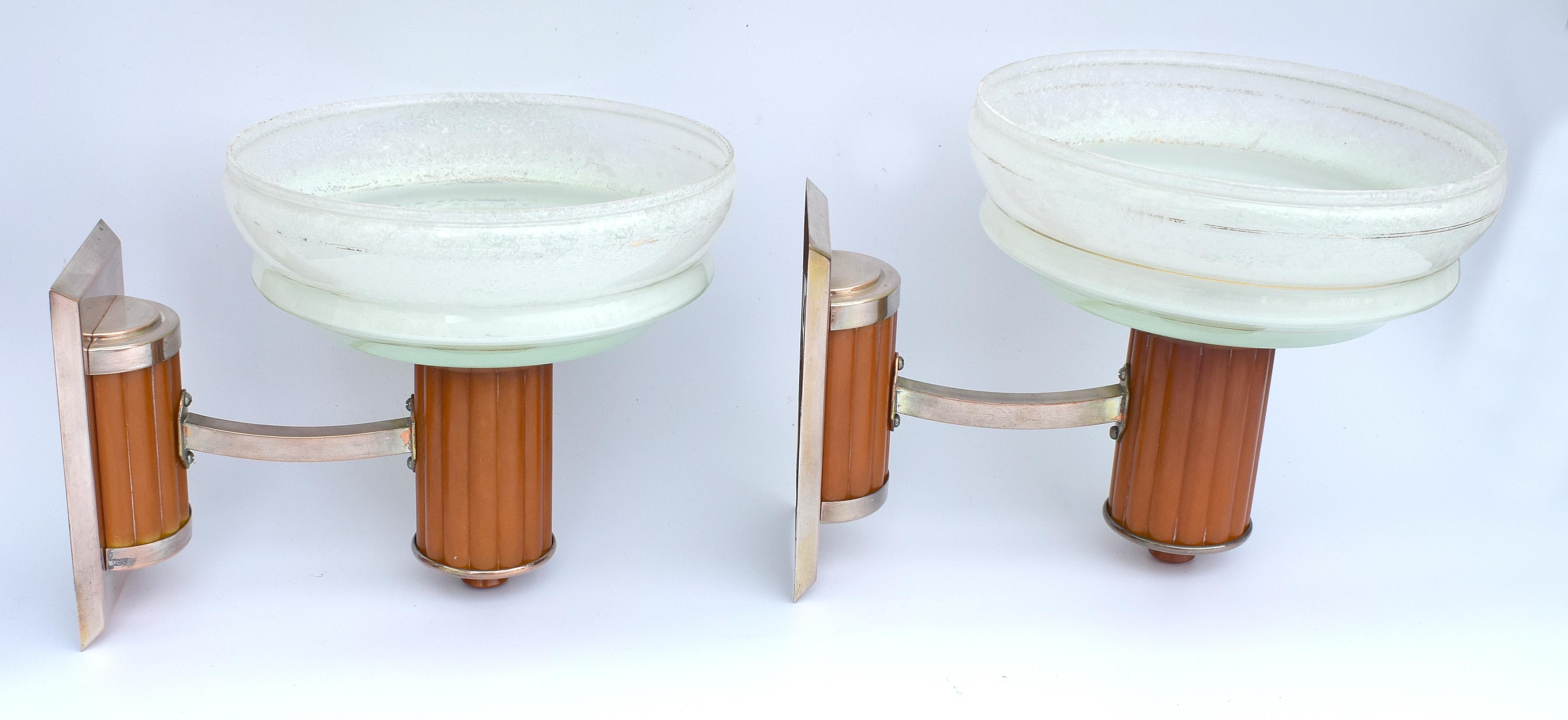A very rare chance to acquire a pair of matching Art Deco wall light sconces. Made from butterscotch coloured catalin/phenolic Bakelite and chrome metal-ware with mottled glass pale green coloured shades. These lights make a great statement to any