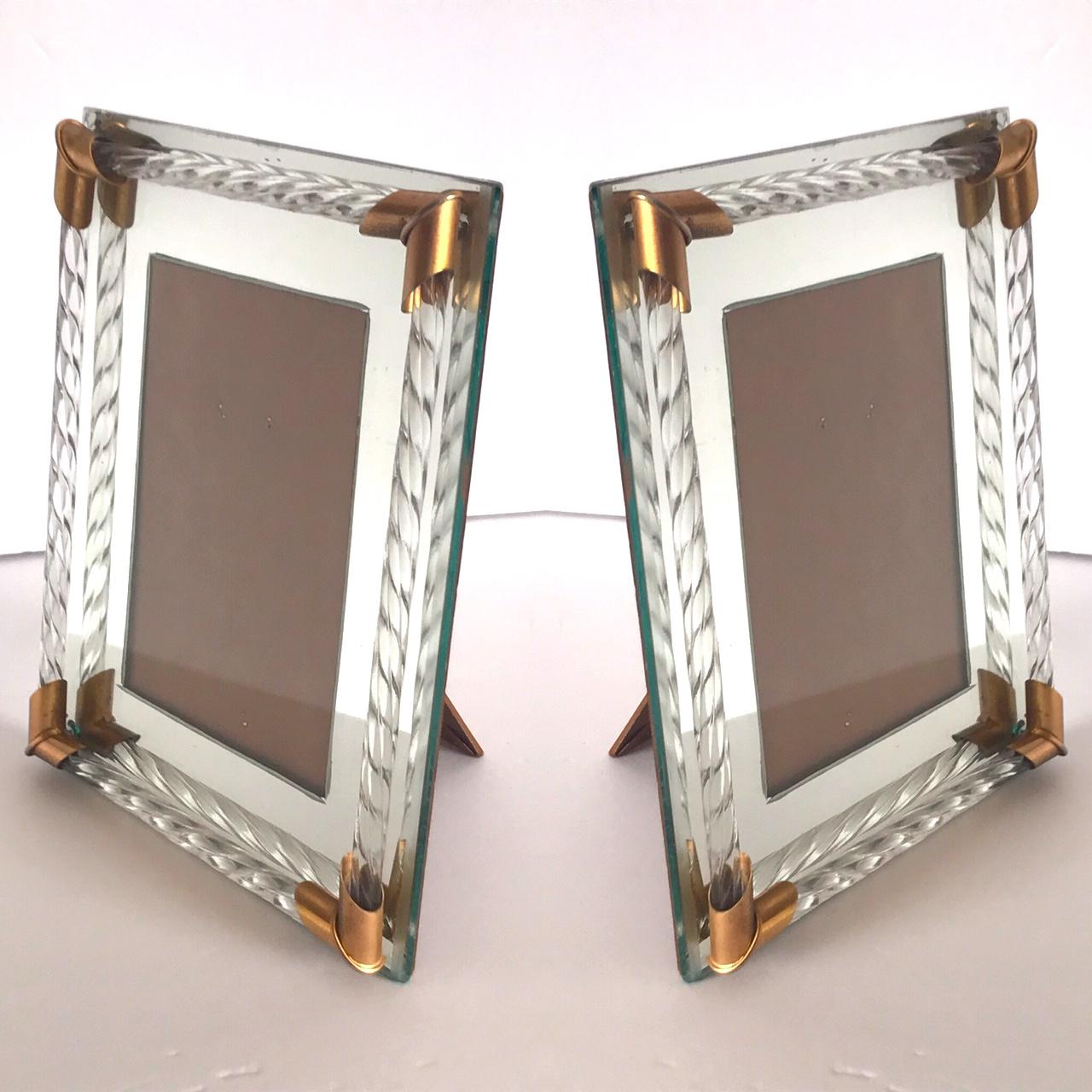 Pair of gorgeous Italian Hollywood Regency mirrored picture frames with Murano glass rods in the form of twisted rope. The picture frames hold 4