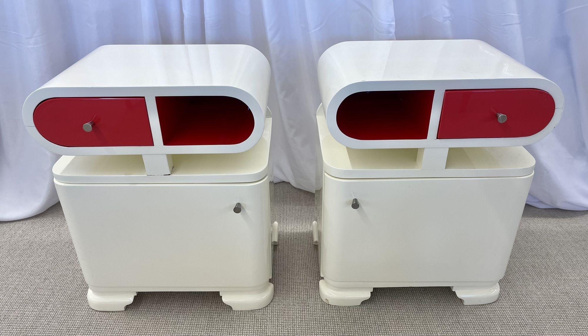 Pair of Art Deco nightstands / end tables, white and candy apple Red Lacquer, Space Age Modern Style
 
Pair of R2D2 Art Deco nightstands, side tables, or end tables in white and red lacquer. Both pieces offer ample storage with the top having one