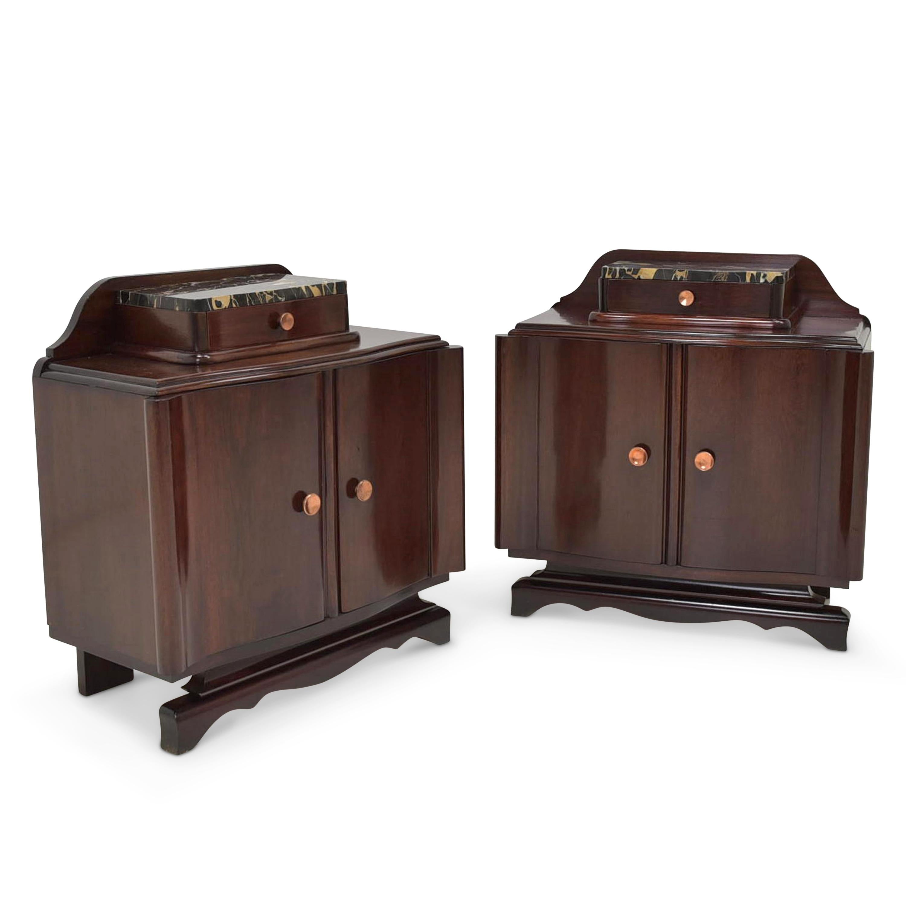 Pair of nightstands restored Art Deco circa 1930 mahogany nightstand

Features:
Each with two doors with a small drawer and a shelf
Very high quality processing
Drawers pronged
Original marble slabs
Original handles
Beautiful