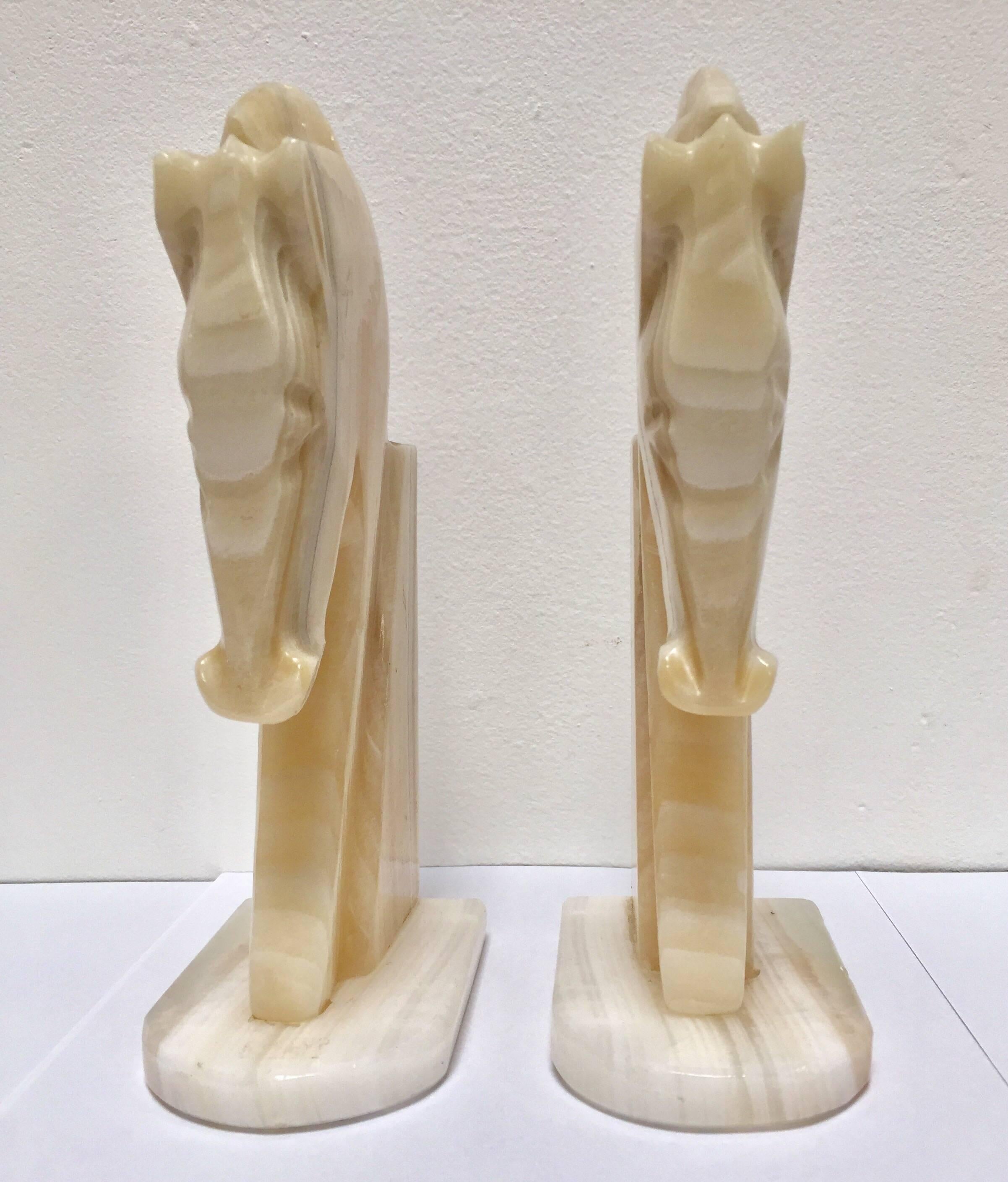 Pair of Art Deco style stylized horses head bookends.
Vintage set of bookends, hand-carved in onyx in a shade of ivory and browns.
Hermes style horses, great modern design.
Measures: Each horse head measure 8.5