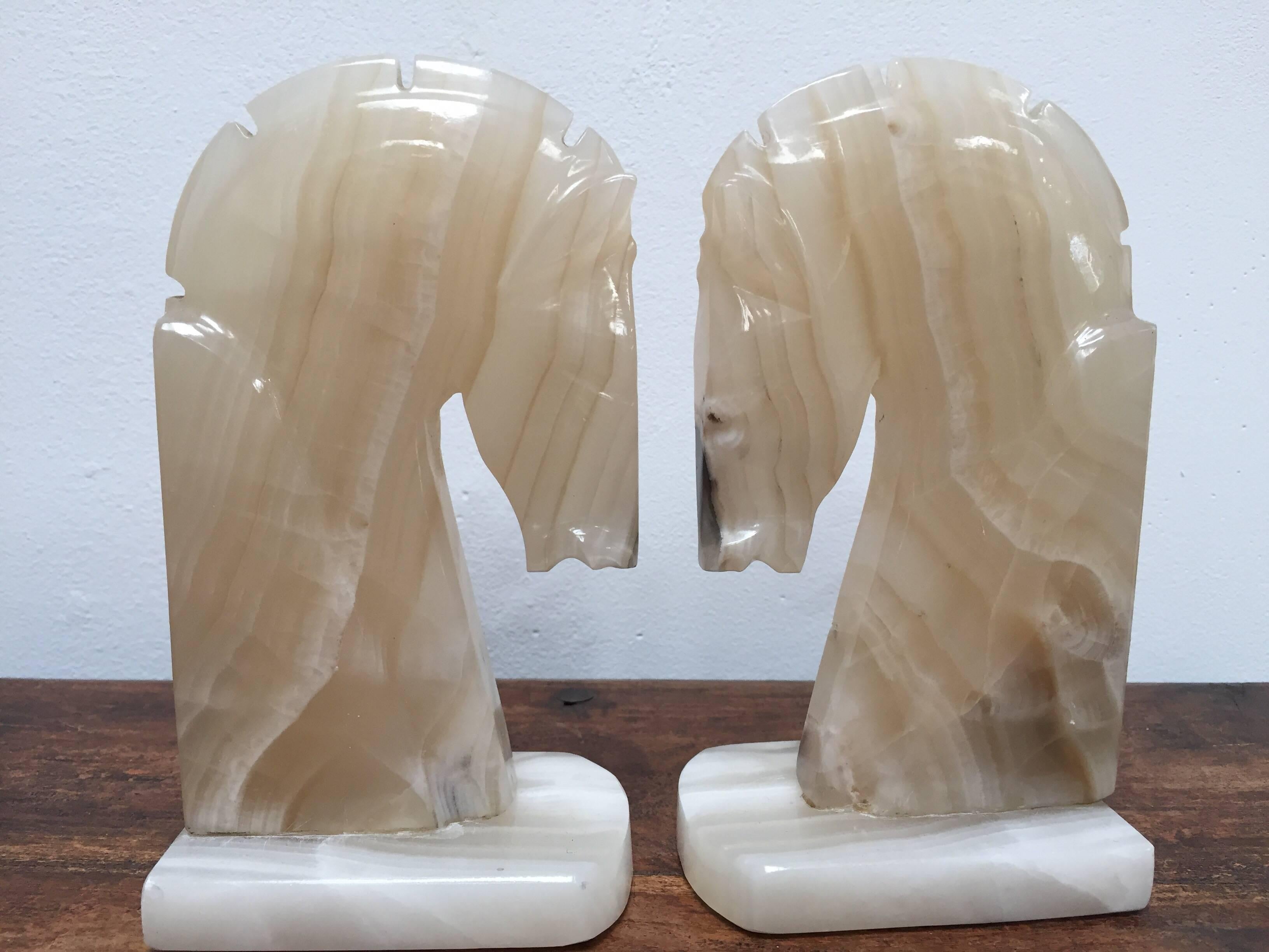 Pair of Art Deco style stylized horses head bookends.
Vintage set of bookends, hand-carved in onyx in a shade of ivory and browns.
Hermes style horses, great modern design.
Measures: Each horse head measure 7.5
