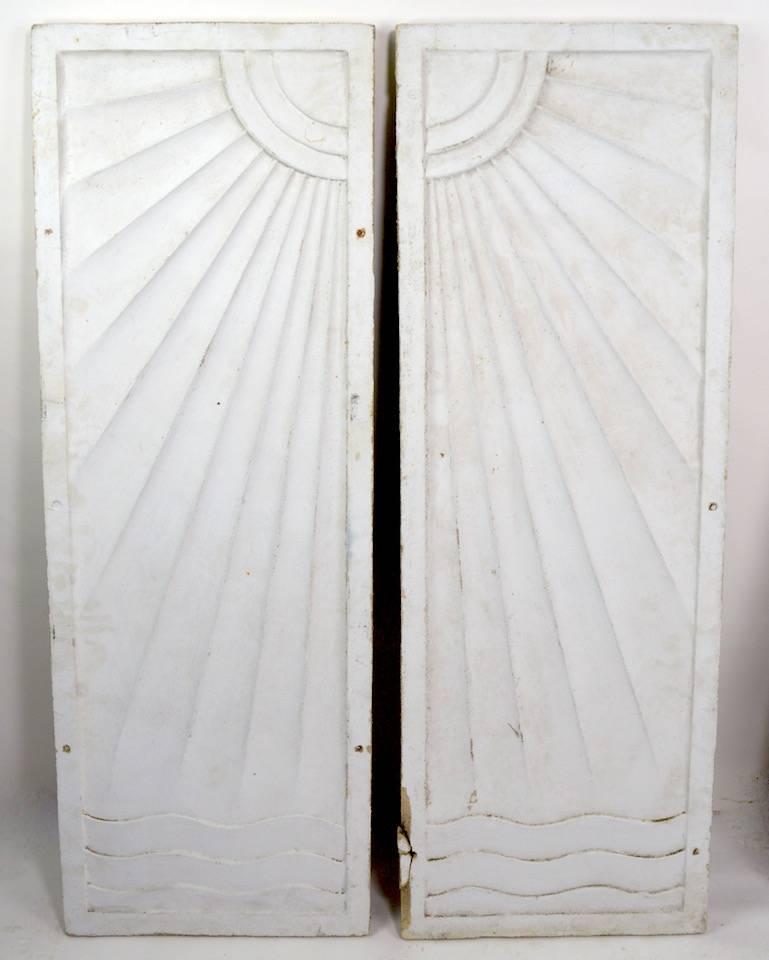 Wonderful cast stone Art Deco frieze one of two pairs we are offering, please view the matched set listed separately. 
 The panels depict the sun over water, with dramatized Art Deco school rays, and waves. These panels were originally in place in