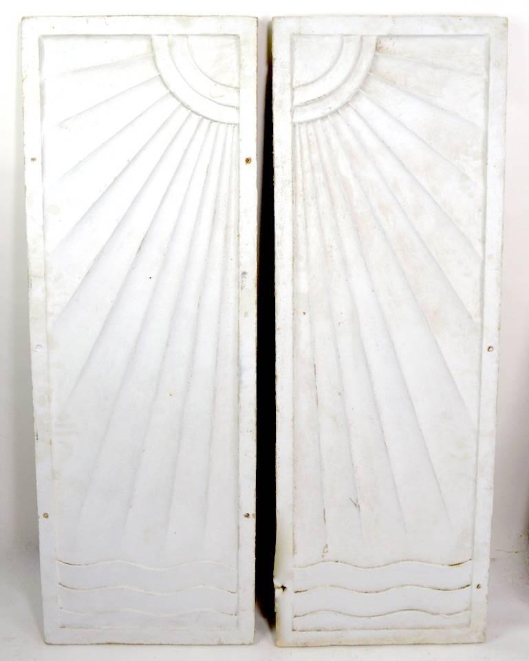 Wonderful cast stone Art Deco frieze one of two pairs we are offering.
The panels depict the sun over water, with dramatized Art Deco School rays, and waves. These panels were originally in place in a nightclub, speakeasy, casino in Saratoga NY