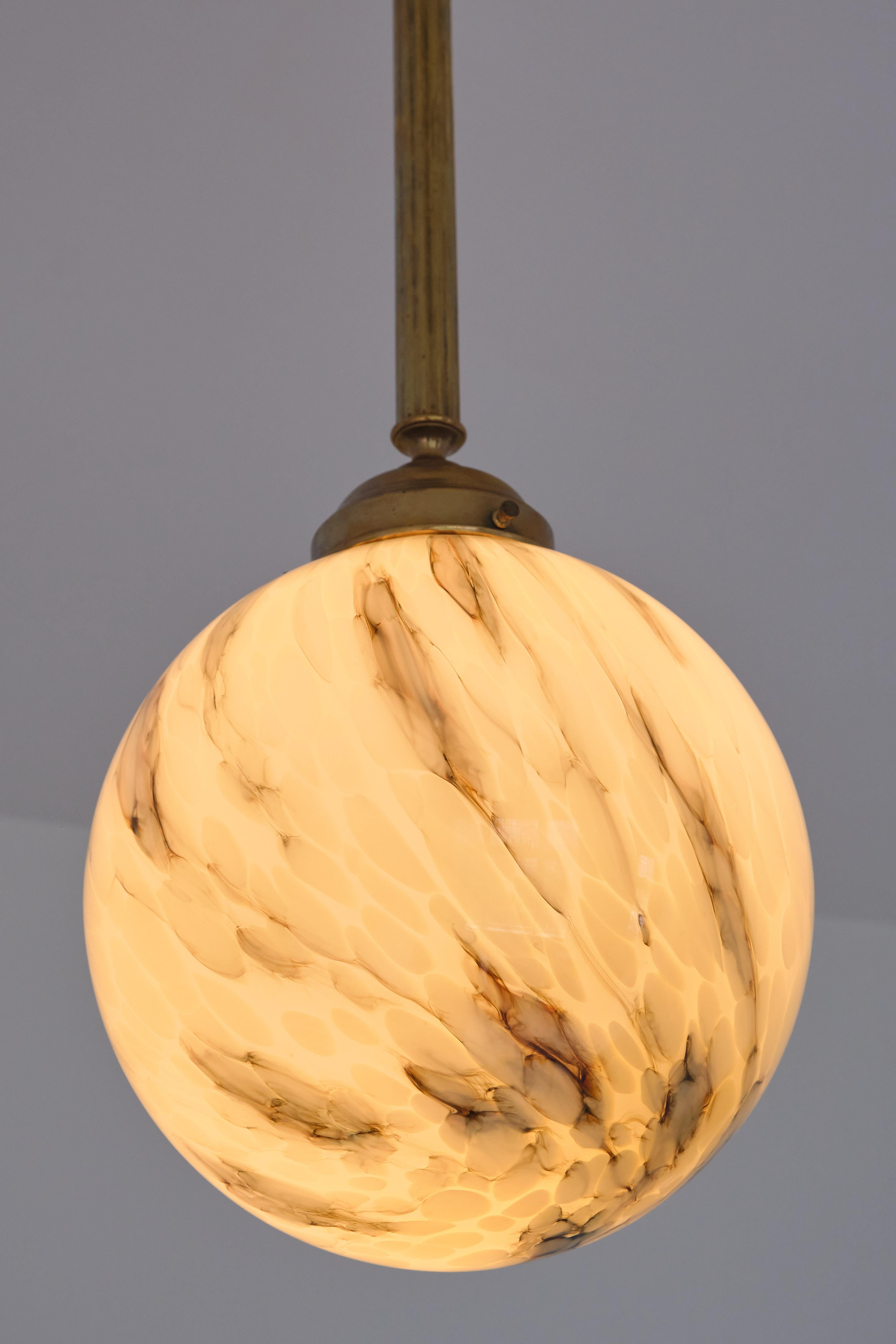 Pair of Art Deco Pendants in Brass and Marbled Glass, De La Mar Theatre, 1940s In Good Condition In The Hague, NL