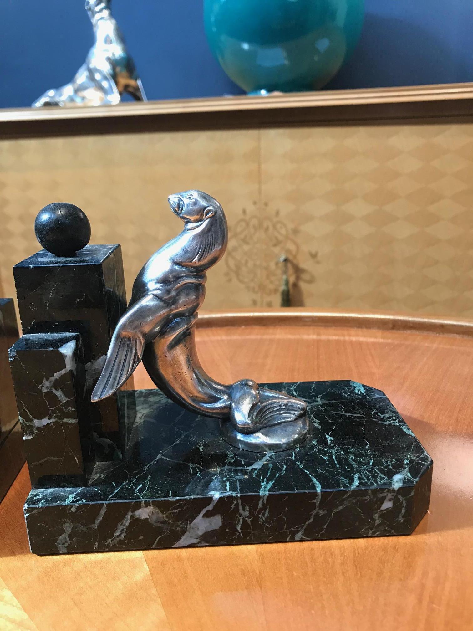 Pair of Art Deco period silvered bronze and antico verde marble bookends representing seals by Maurice Frécourt. Signed: “Frecourt” 



   
 