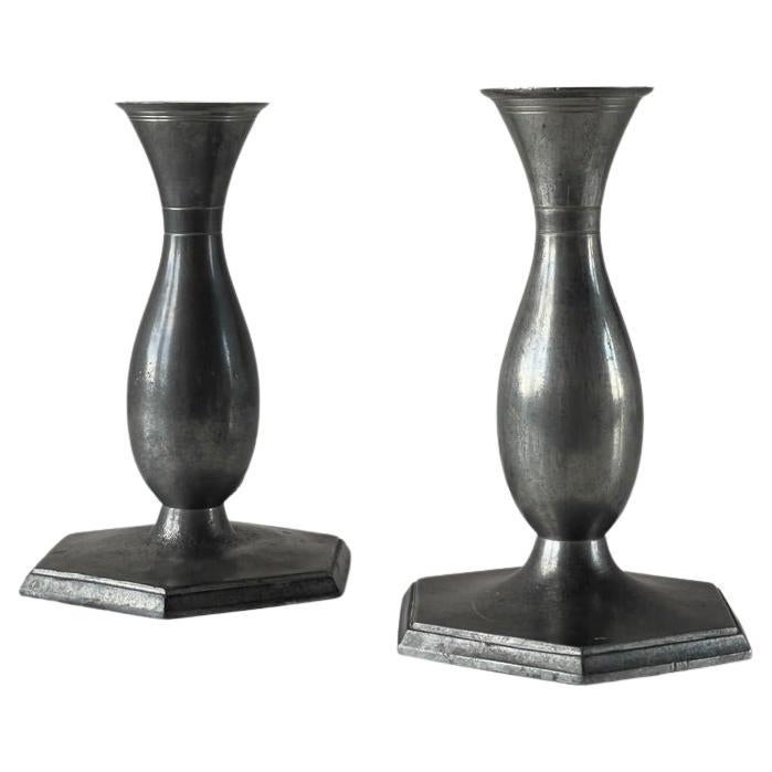 Pair of danish art deco metal candlesticks by sculptor Just Andersen. 1920s