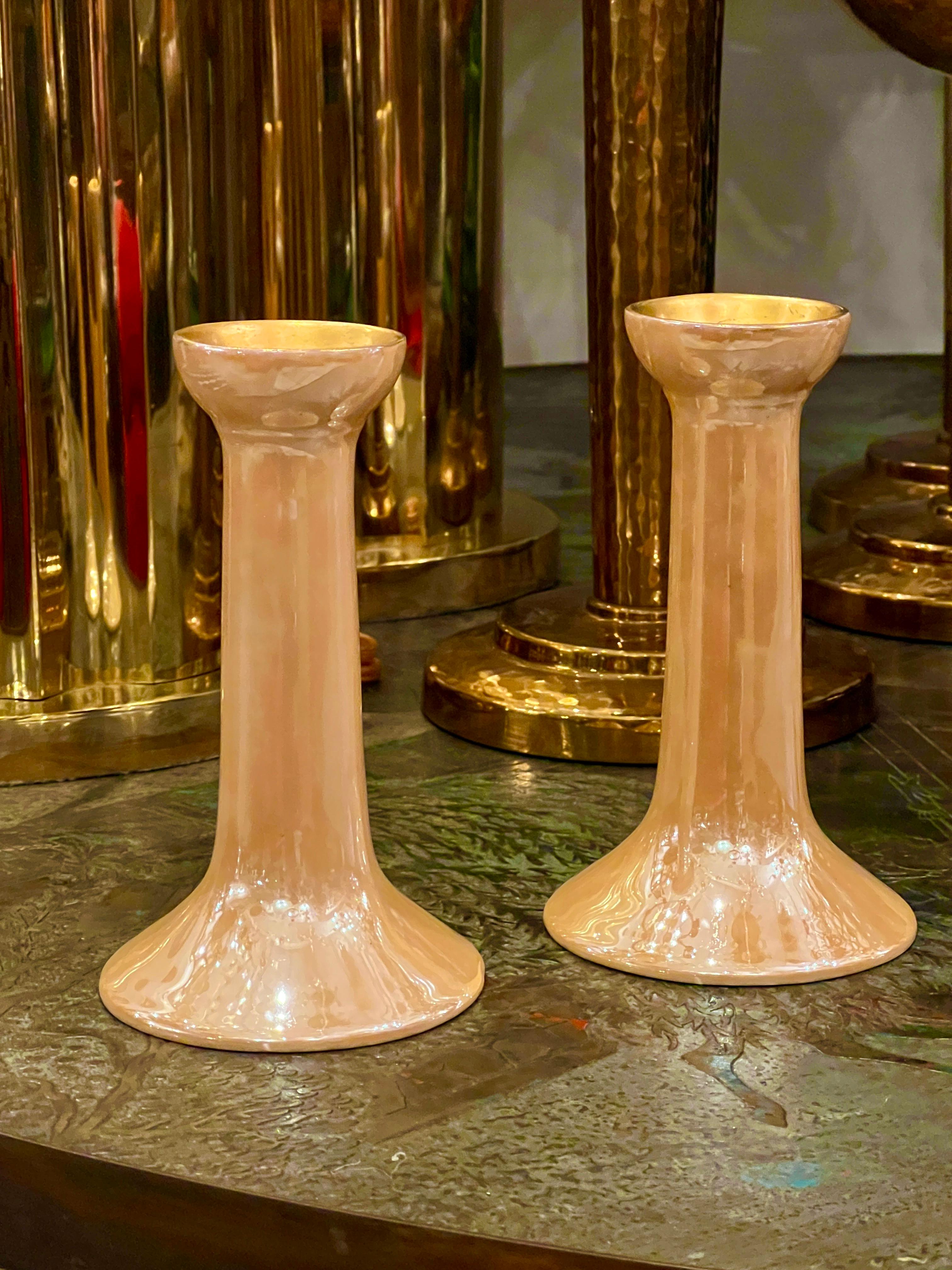 A pair of Art Deco circa 192o'a French luster-glazed porcelain candlesticks.

Measurements:
Height of body: 6.5