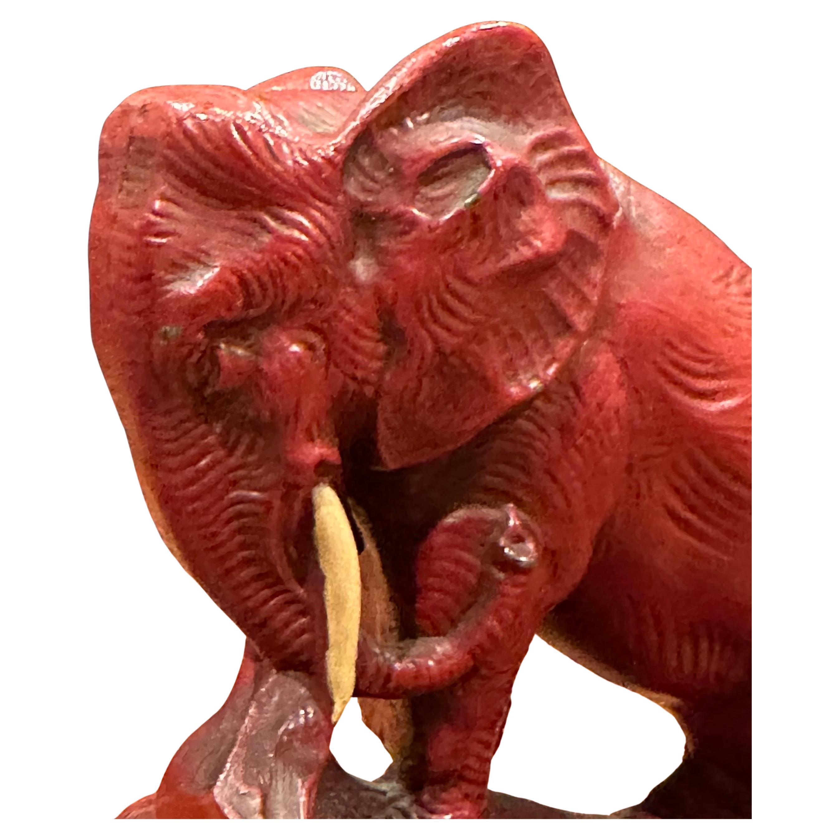 20th Century Pair of Art Deco Red Painted Charging Elephant Bookends For Sale