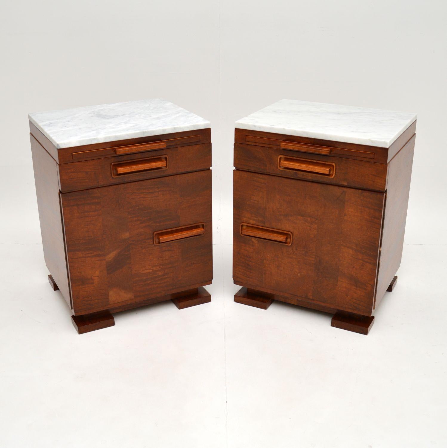A stunning pair of Art Deco period bedside cabinets in satin birch, with white marble tops. These were made in continental Europe, most likely Sweden, they date from the 1920-1930’s period.

They are outstanding quality, and are polished on the