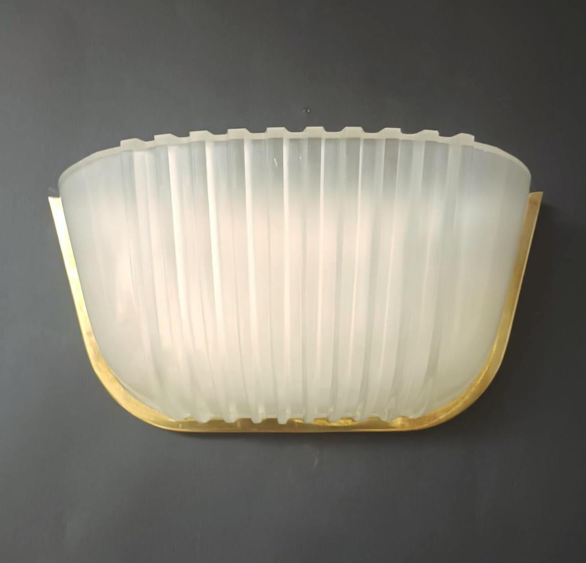 Vintage French wall light with Art Deco ribbed frosted glass / made in France circa 1930s
2 lights / E12 or E14 type / max 40W each
Measures: Height 6 inches / Width 13 inches / Depth 5 inches
1 pair in stock in Italy.
  