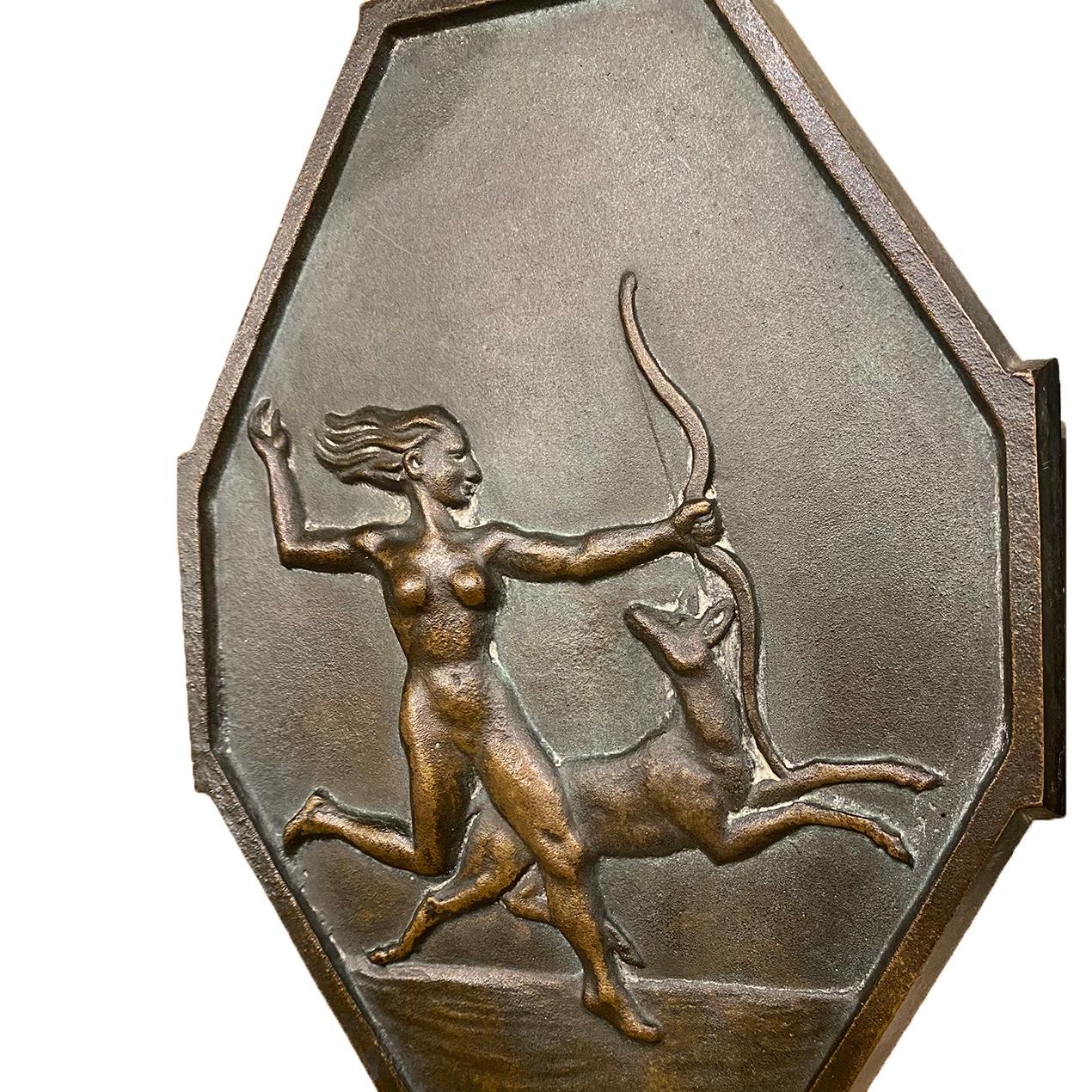 Pair of circa 1930's single-light French patinated bronze sconces depicting Diana hunting.

Measurements:
Height: 10.5