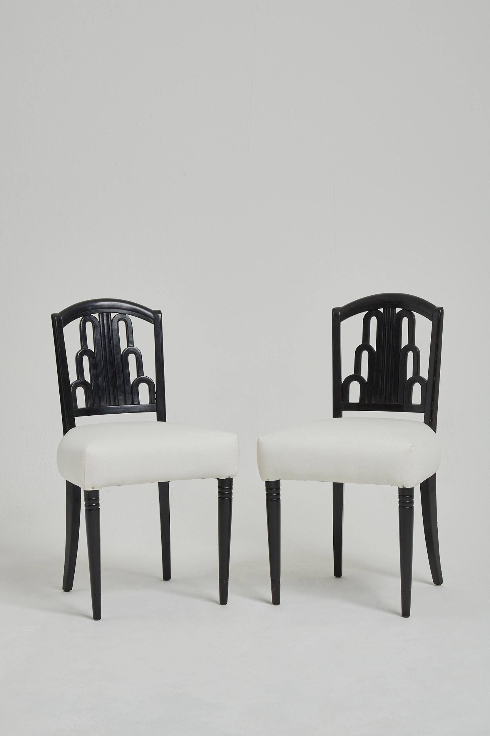 A pair of Art Deco ebonised beech side chairs, the backs of stylised fountain design. 
France, Circa 1930.
    