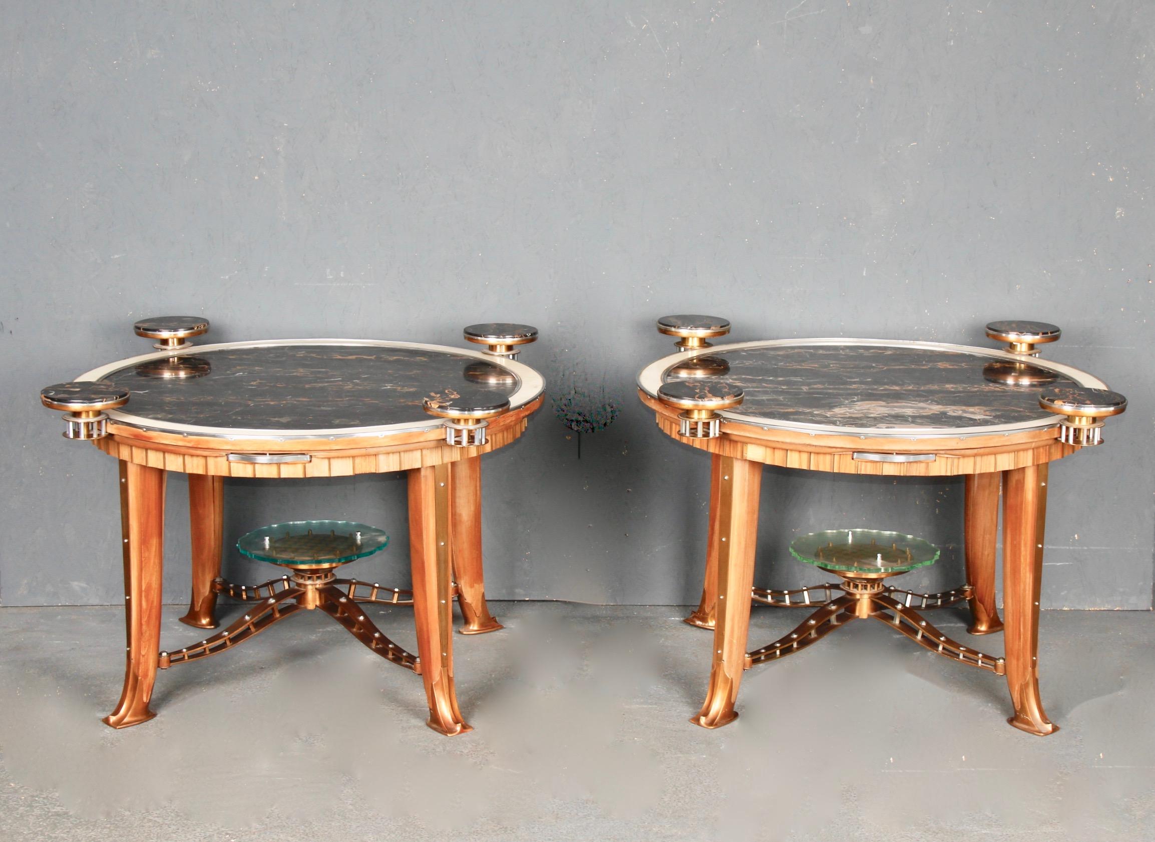 Pair of Art Deco side table, each table has 4 small shelves that can be opened or closed the materials chosen are very rich marble, glass, wood and very sophisticated metal work.