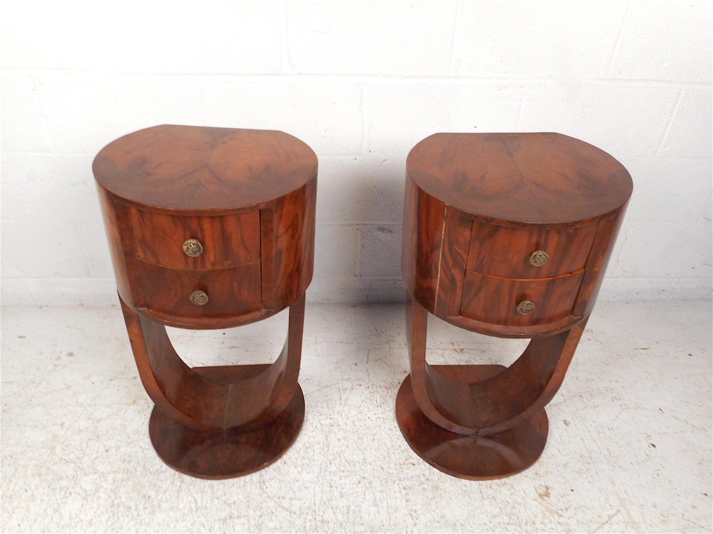 Unique pair of midcentury side tables. Stylish sculptural bases support a compact table with two drawers. Very unusual and interesting pieces sure to make an impression in any modern interior. Please confirm item location with dealer (NJ or NY).