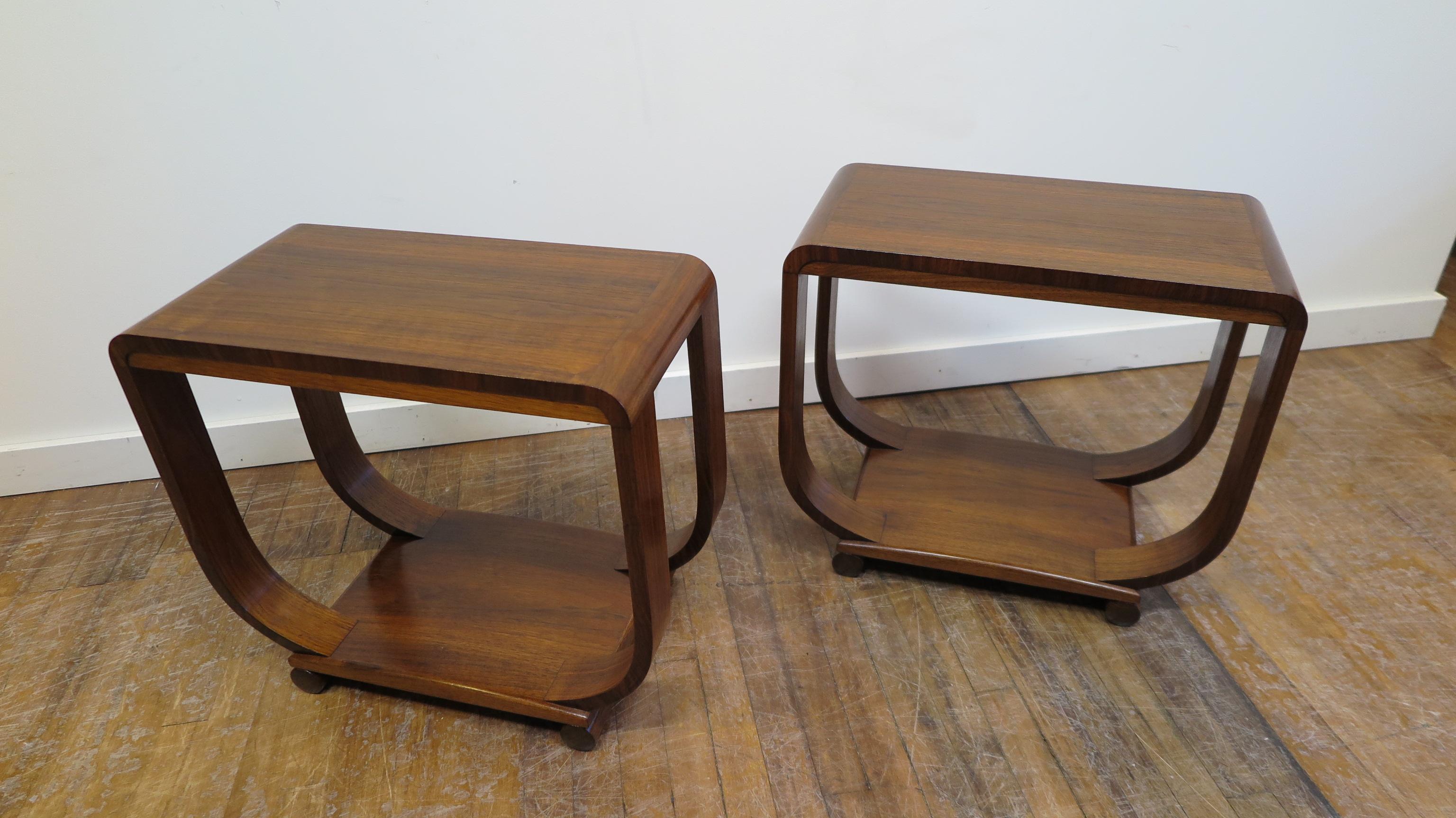 Elegant pair Art Deco Side Tables. Walnut veneer Side Tables with Radius edge top, banded side detail, turned in legs atop a raised arch platform on cylindrical feet. Finely crafted in very good condition.