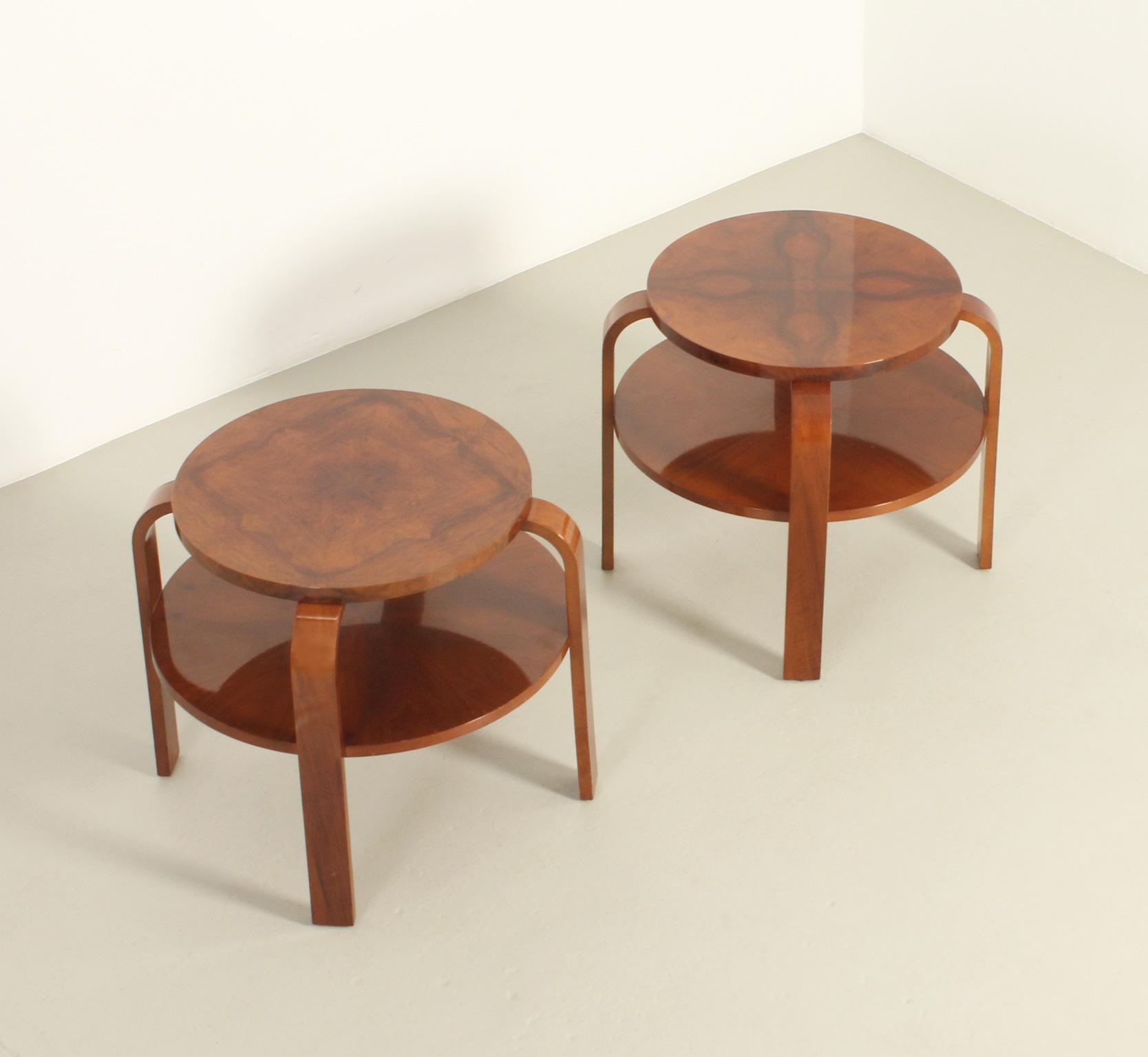 Pair of Art Deco coffee or side tables from 1930s, Spain. Walnut veneered wood with glossy varnish finish. Tops with different pattern veneer and lower tier shelf.