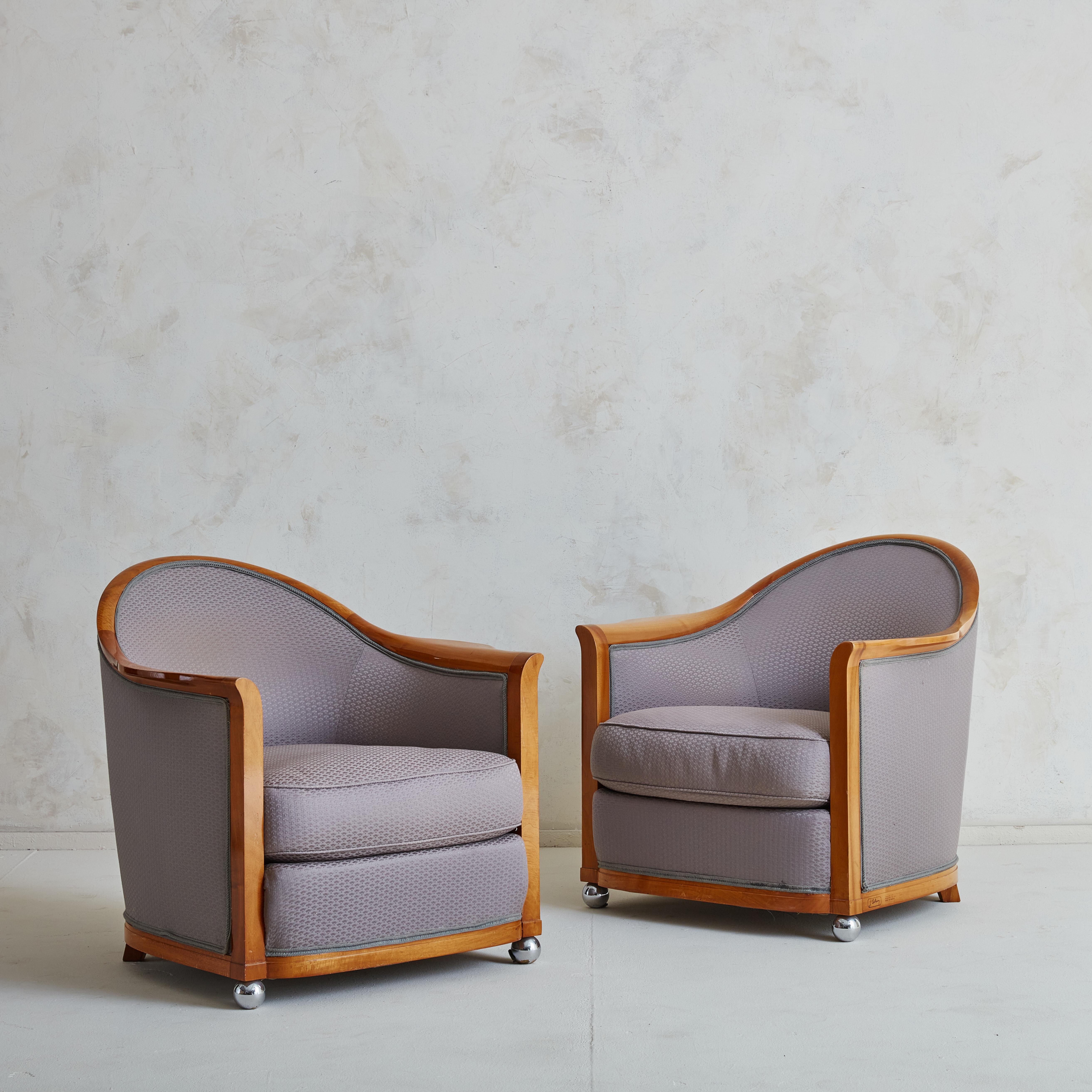 Beautiful pair of art déco armchairs Designed by Jules Leleu in 1929,  and re-issued in 1986 for La Mamounia hotel Marrakesh which was commissioned by Jacques Garcia. 
This beautiful pair of armchairs have been produced in a stunning light wood