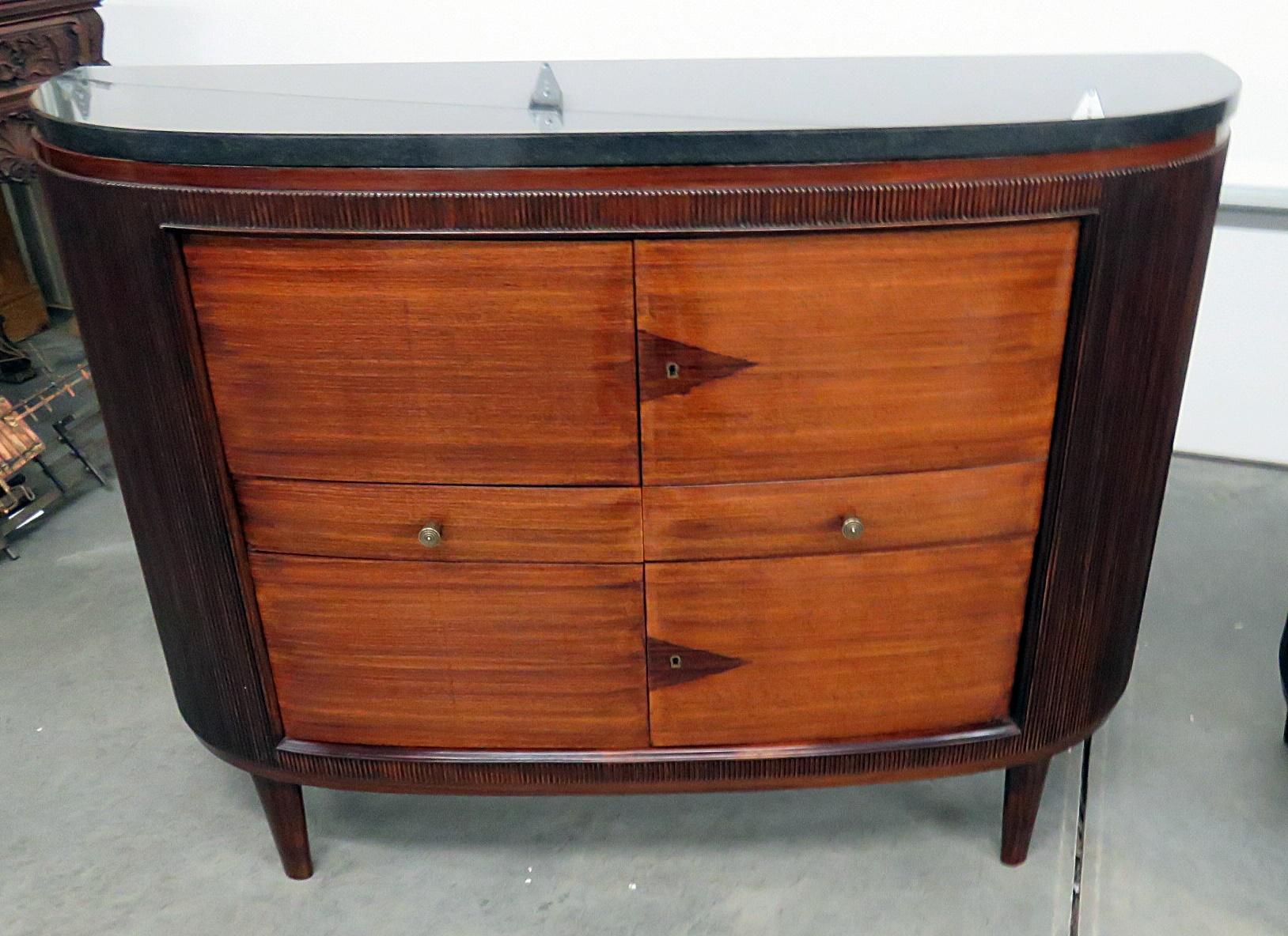 Pair of Art Deco granite top demilune commodes with 4 doors and 2 drawers.
