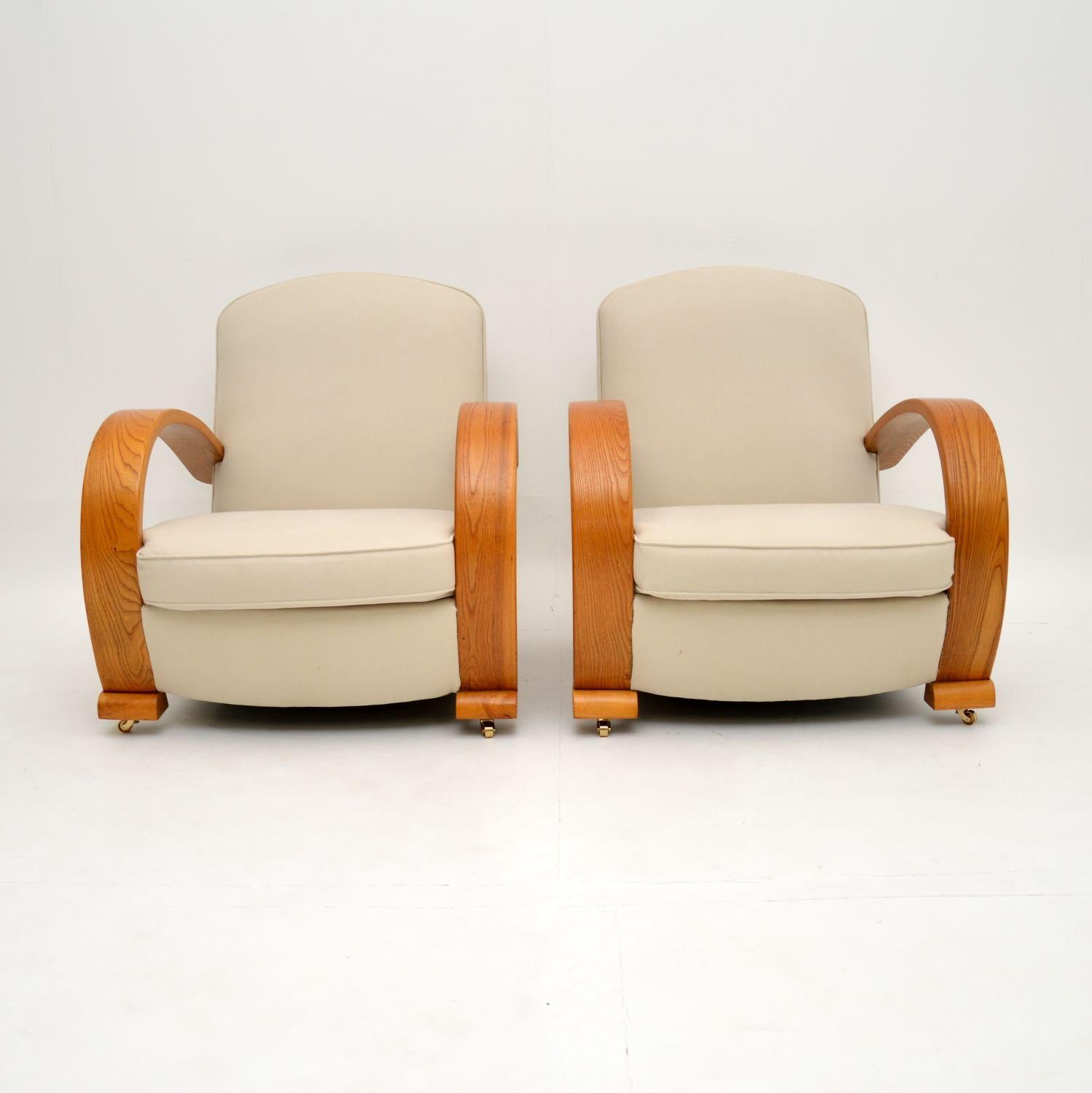 A stunning pair of Art Deco period armchairs, with gorgeous steam bent solid Elm frames. These were made in continental Europe, most likely Sweden, and they date from the 1920-1930’s.

The quality is amazing, they have a striking design and are