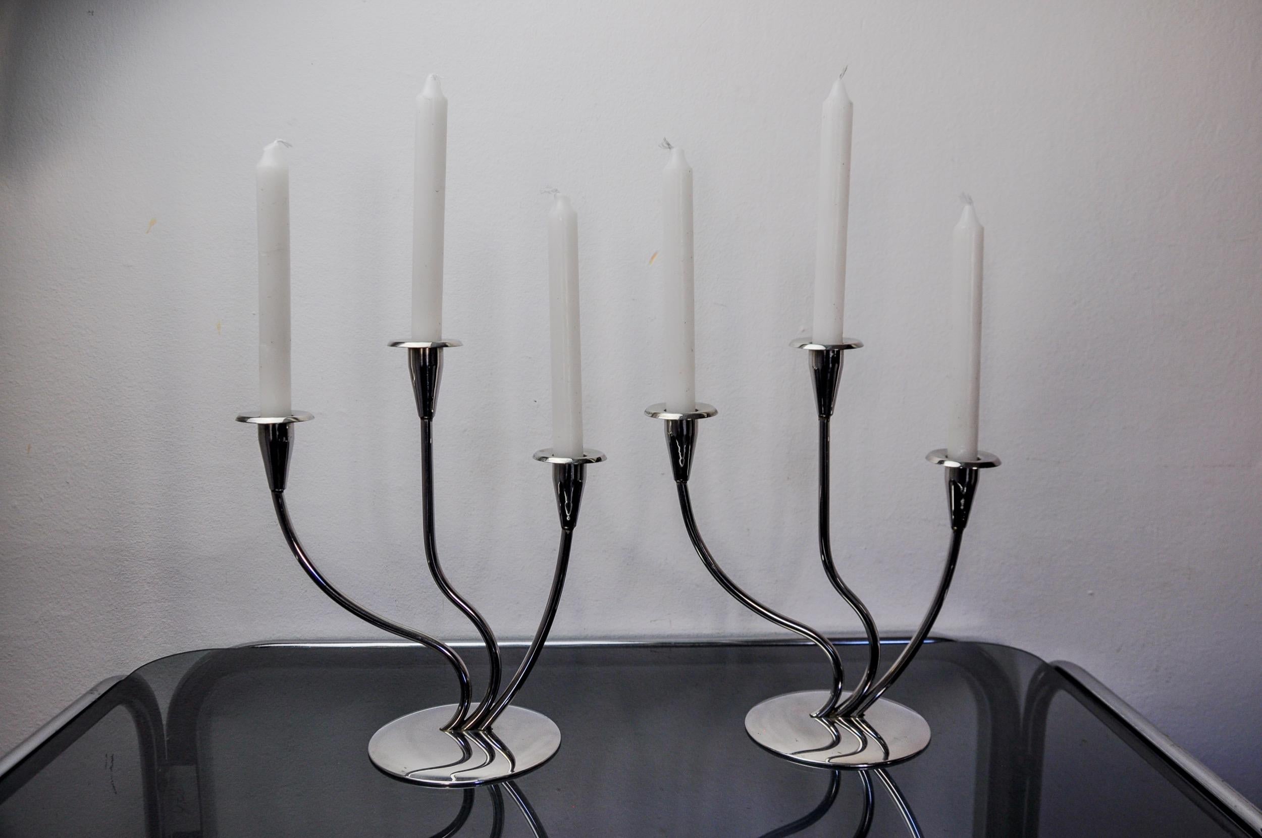 Very beautiful pair of art deco stainless steel candlesticks designed and produced in Spain in the 1970s. Structure in 18/8 stainless steel that can accommodate 3 candles. Superb designer object that will decorate your interior wonderfully. Good