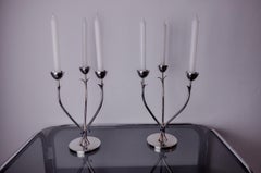 Pair of art deco stainless steel candlesticks with 3 flames and blue