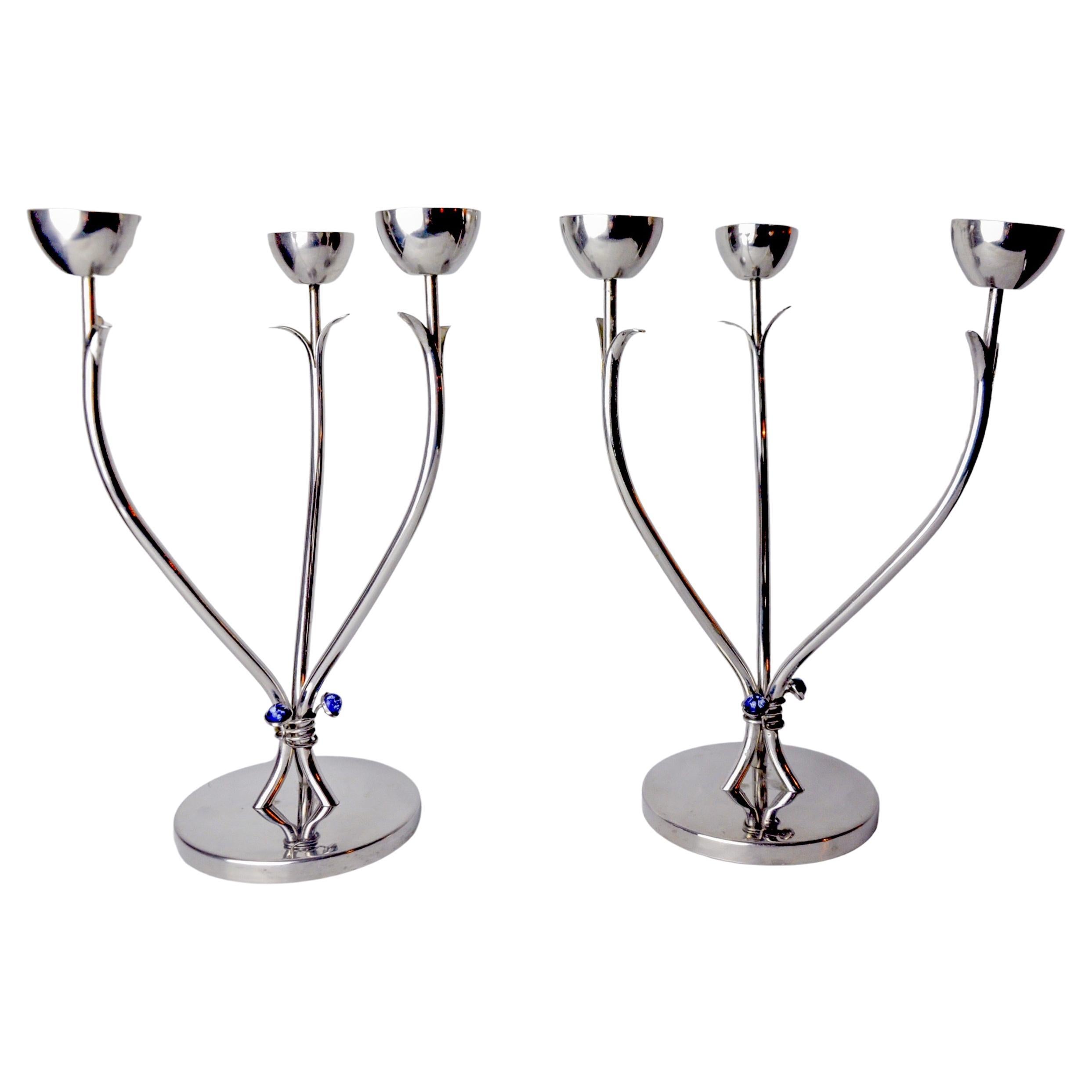 Pair of art deco stainless steel candlesticks with 3 flames and blue