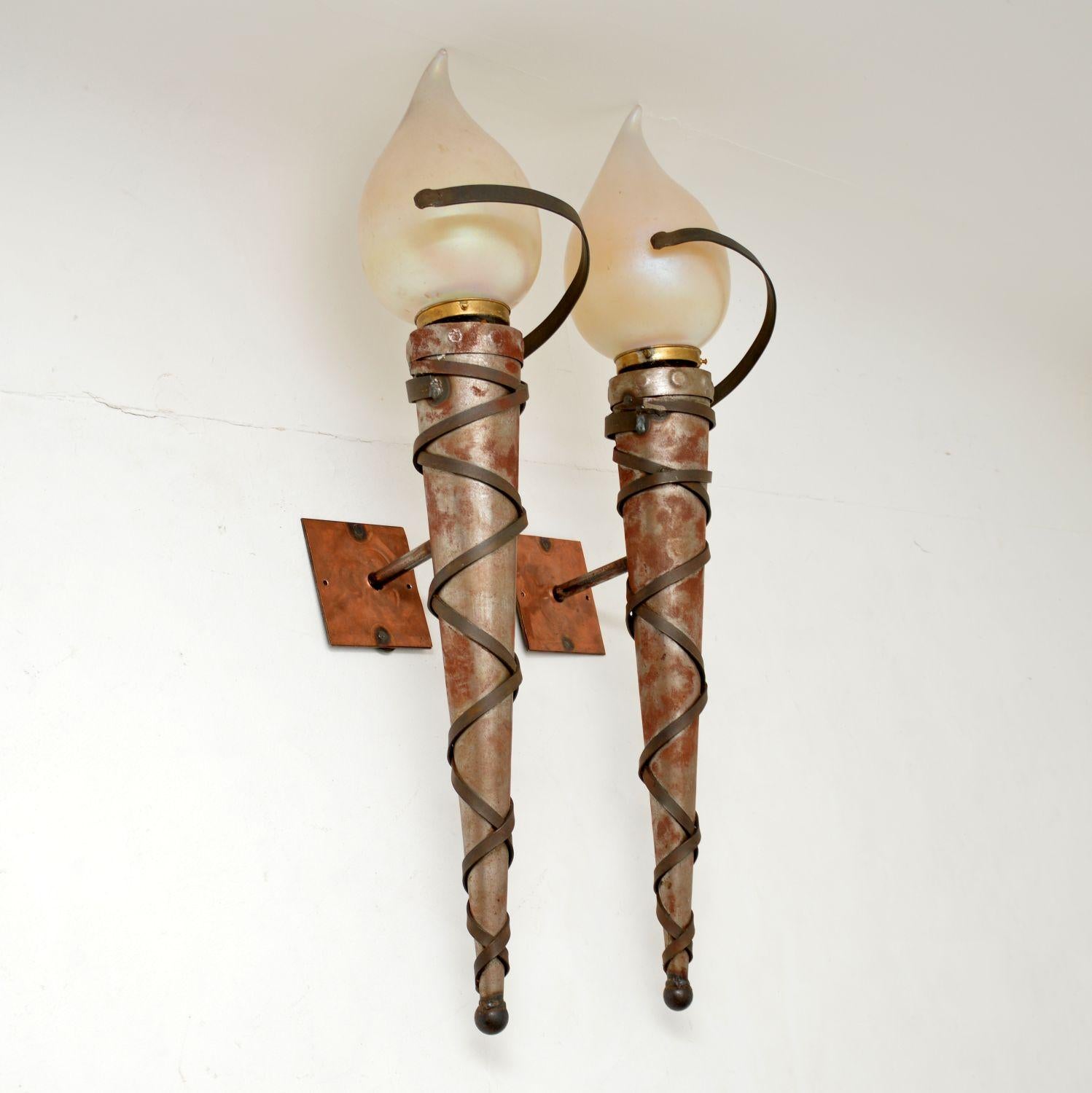 A very large, stunning and extremely unusual pair of original Art Deco Neoclassical wall sconce lamps. These were made in England & I would date them from around the 1920-1930’s period.

They have a fabulous design, and are extremely impressive.
