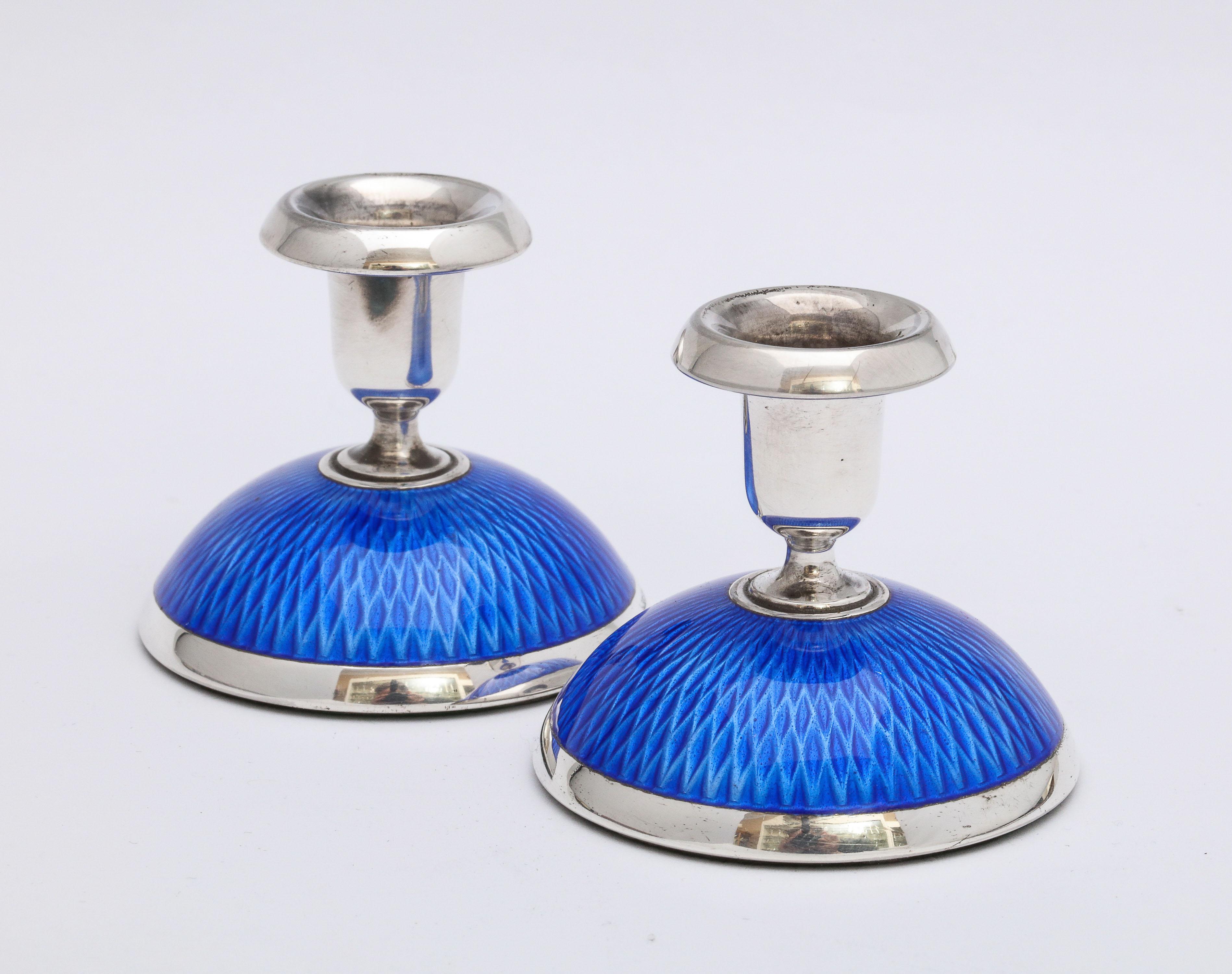 Norwegian Pair of Art Deco Sterling Silver and Dark Blue Guilloche Enamel Candlesticks