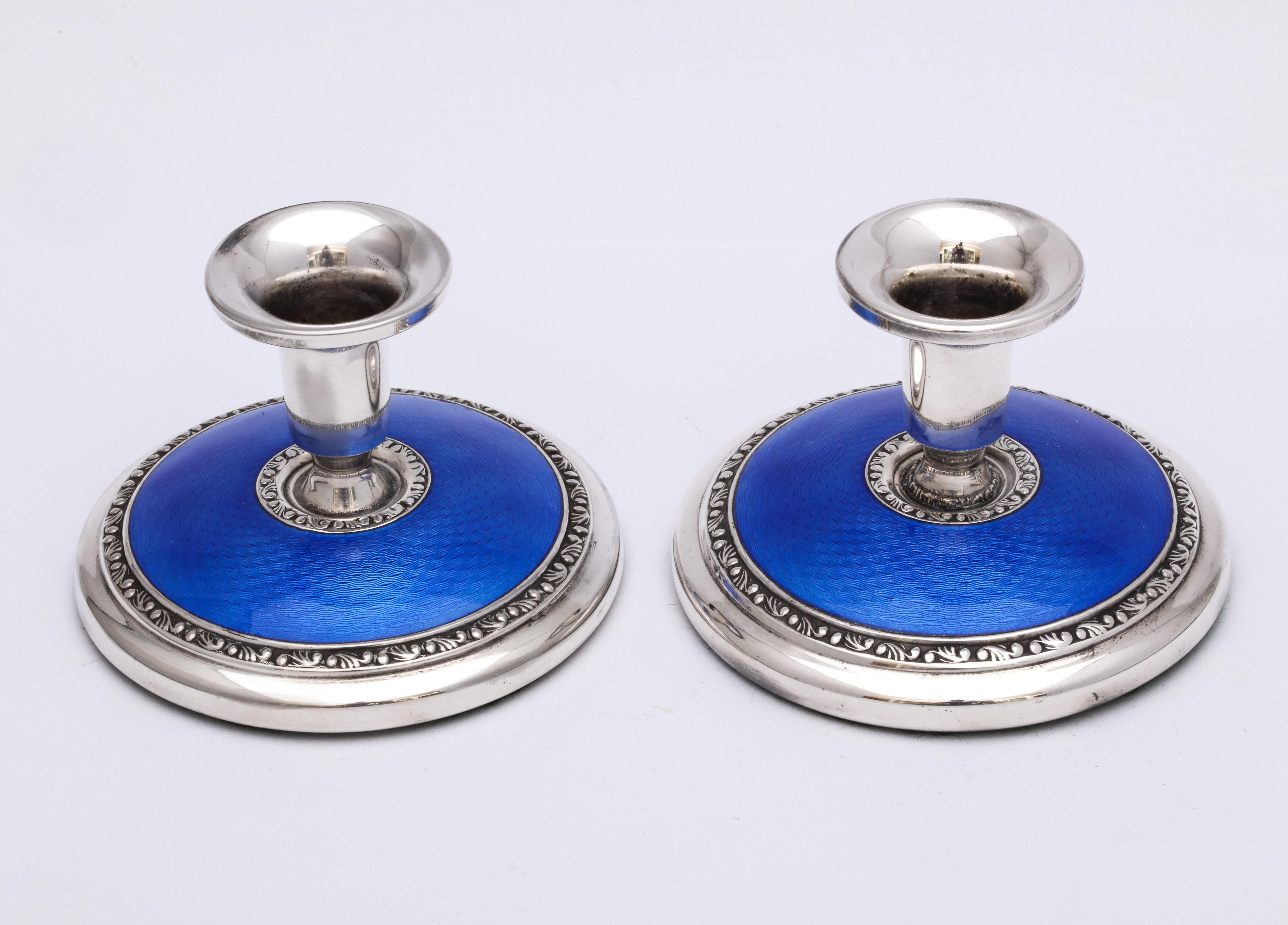 Norwegian Pair of Art Deco Sterling Silver and Deep Blue Guilloche Enamel Candlesticks