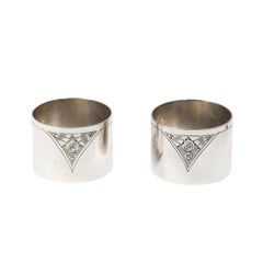 Pair of Art Deco Sterling Silver Napkin rings with Chased Floral Cubist Motif