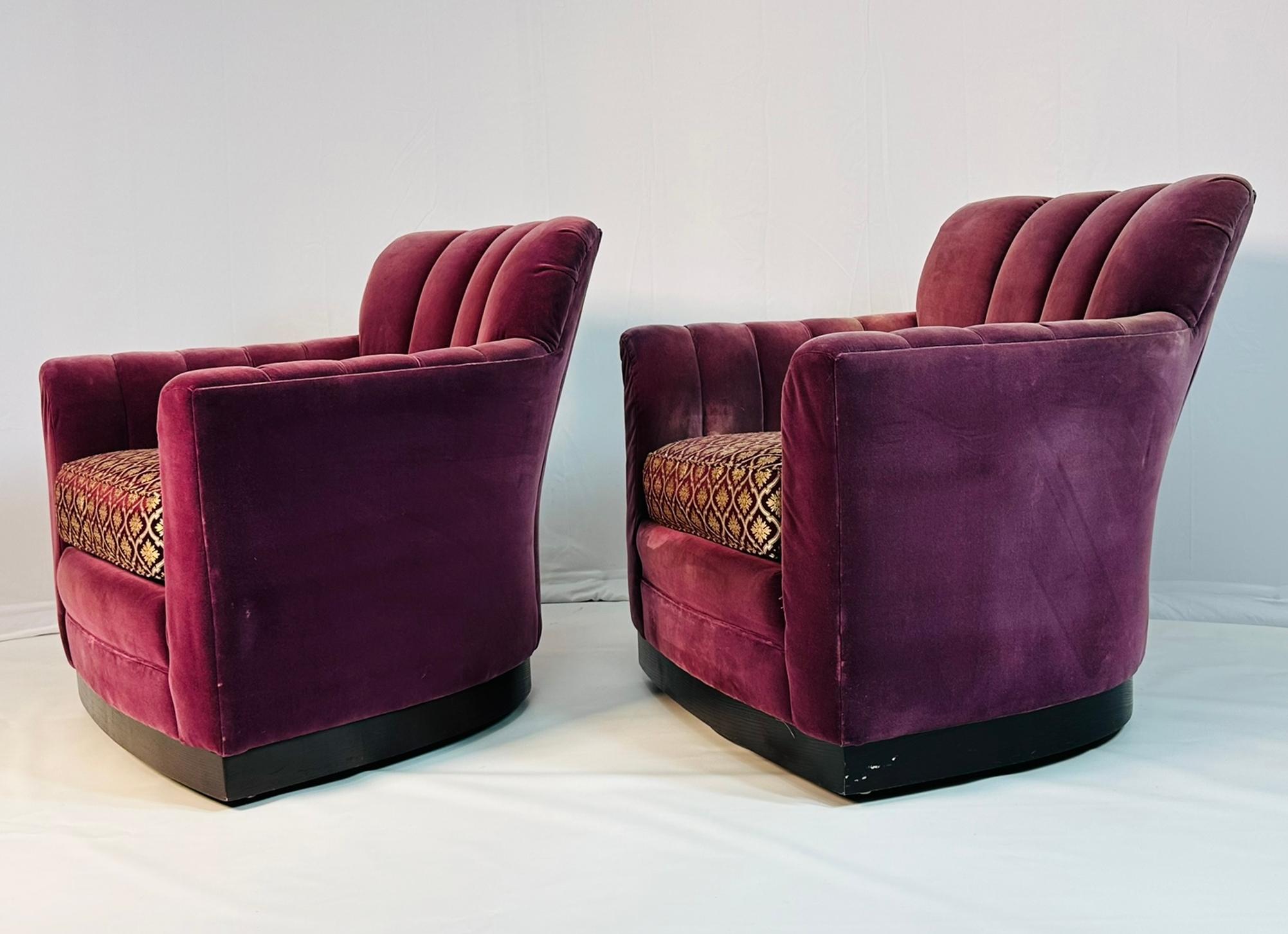 Pair of Art Deco style armchairs designed and manufactured in the USA by Michael Weiss for Vanguard Furniture.
 
The chairs are on a swivel mechanism which allows them two swivel 360 degrees, they come upholstered in the original fabric that feels