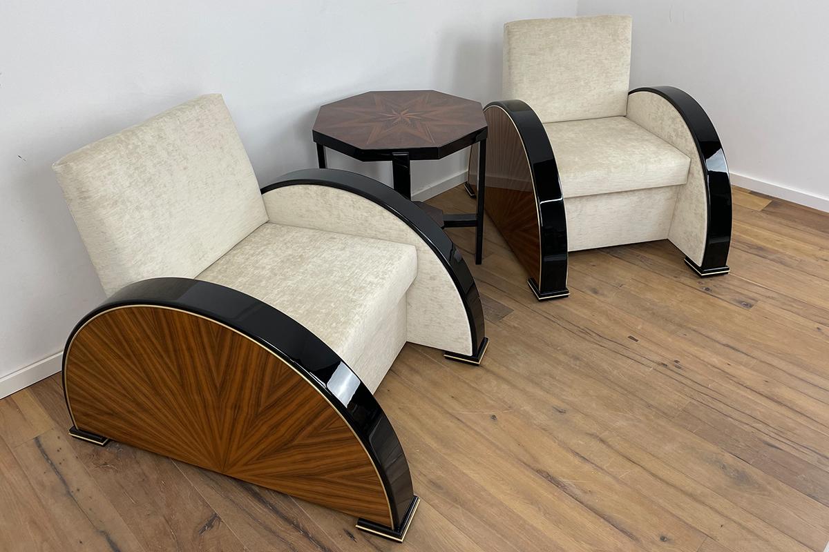 This pair of Art Deco style armchairs in walnut and black piano lacquer with brass details and fabric by Andrew Martin (Mossop Natural) have been handcrafted to the very highest quality. The seating comfort is excellent thanks to the structure of