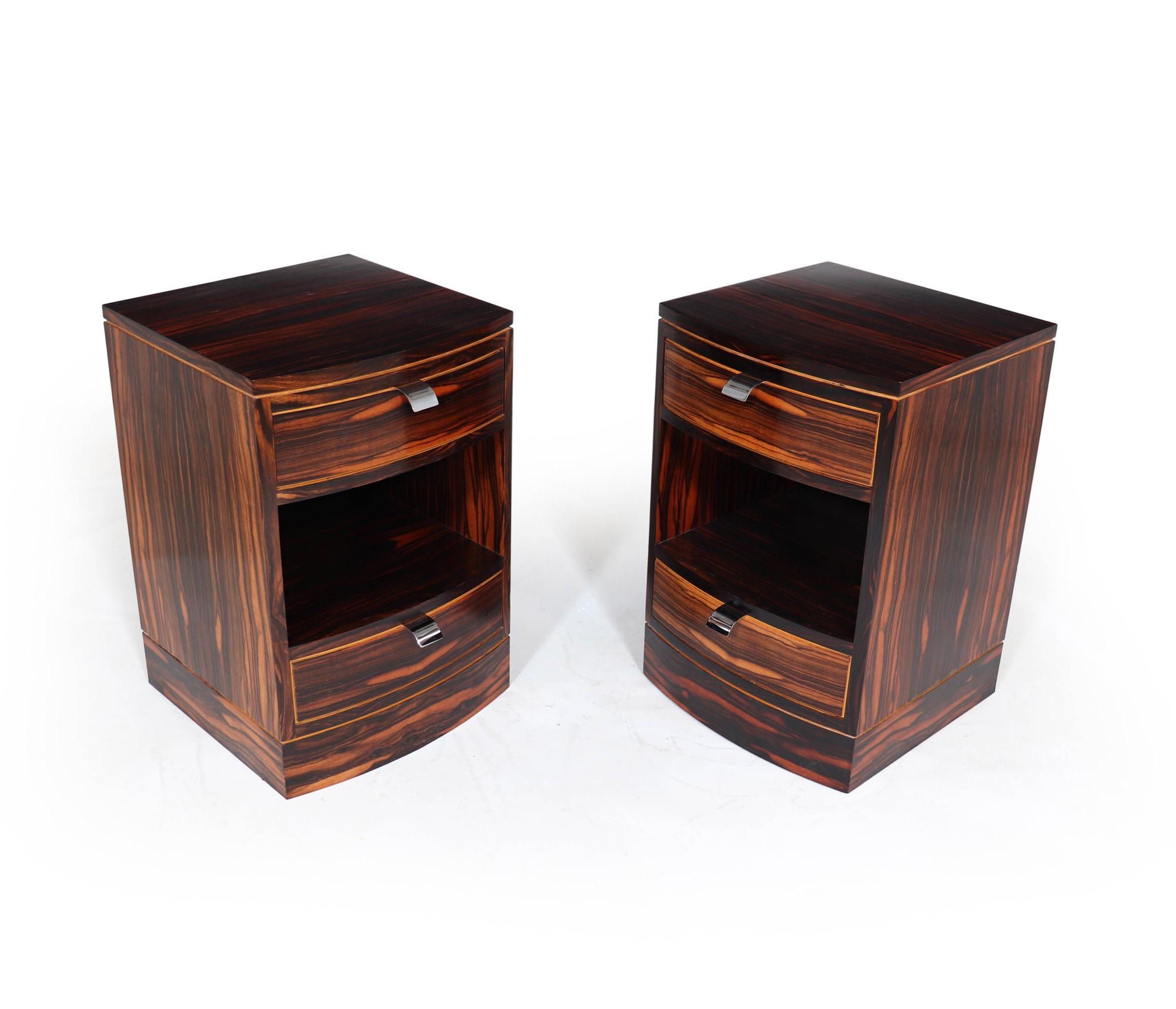 A great quality pair of bedside tables made in the Art Deco manner having bowed fronts and boxwood detail, the chests have two sliding drawers with chrome pull handles, beautifully made but unfortunately not that old the chests have been restored