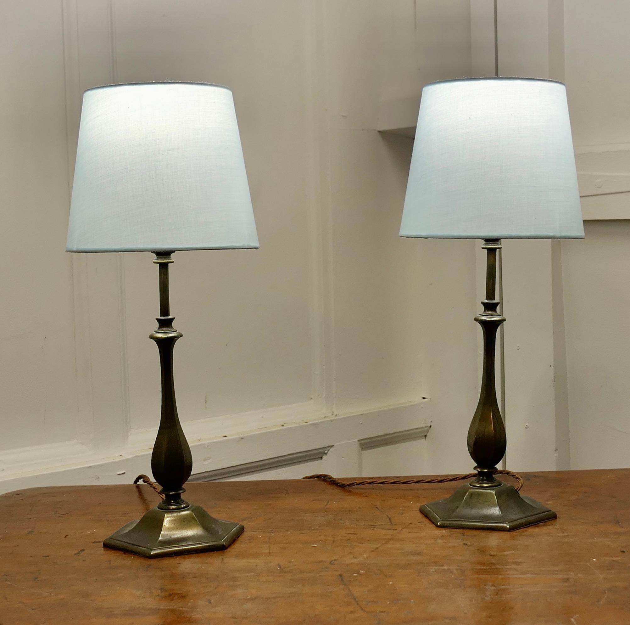 Pair of  Art Deco Style Brass Table Lamps

These are a very stylish pair of lamps, the are made in age darkened brass
The lamps can come with the shades if requested the wiring is new and they are in good condition
The Lamps are 14.5” tall they