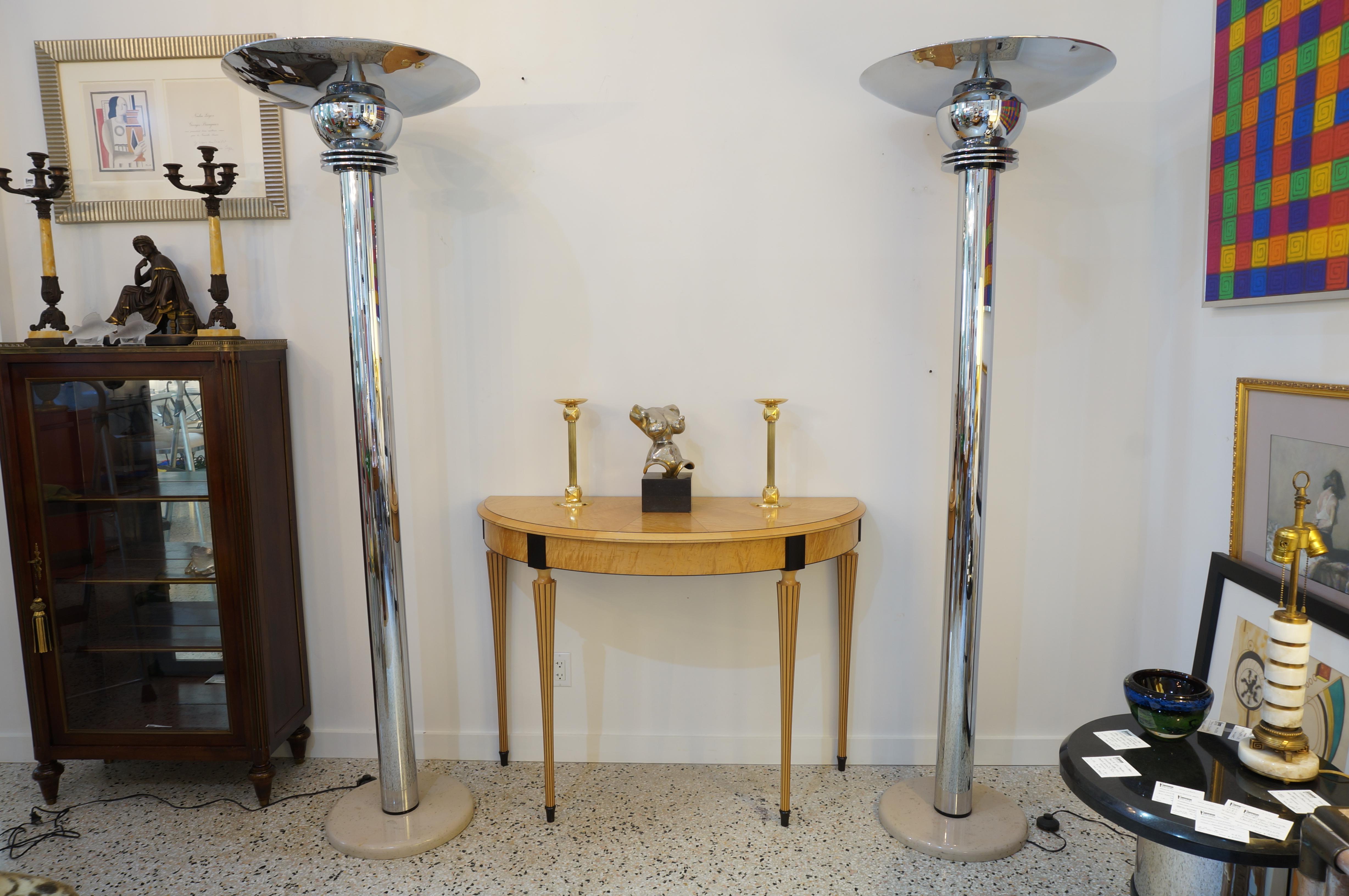 This large scale pair of Art Deco style torcheres are attributed to Jay Spectre and they date to the 1980s. 

Note: Lamps are controled by a line switch on the electrical cord.

Note: Each lamp requires two Edison based light bulbs.

Note: One