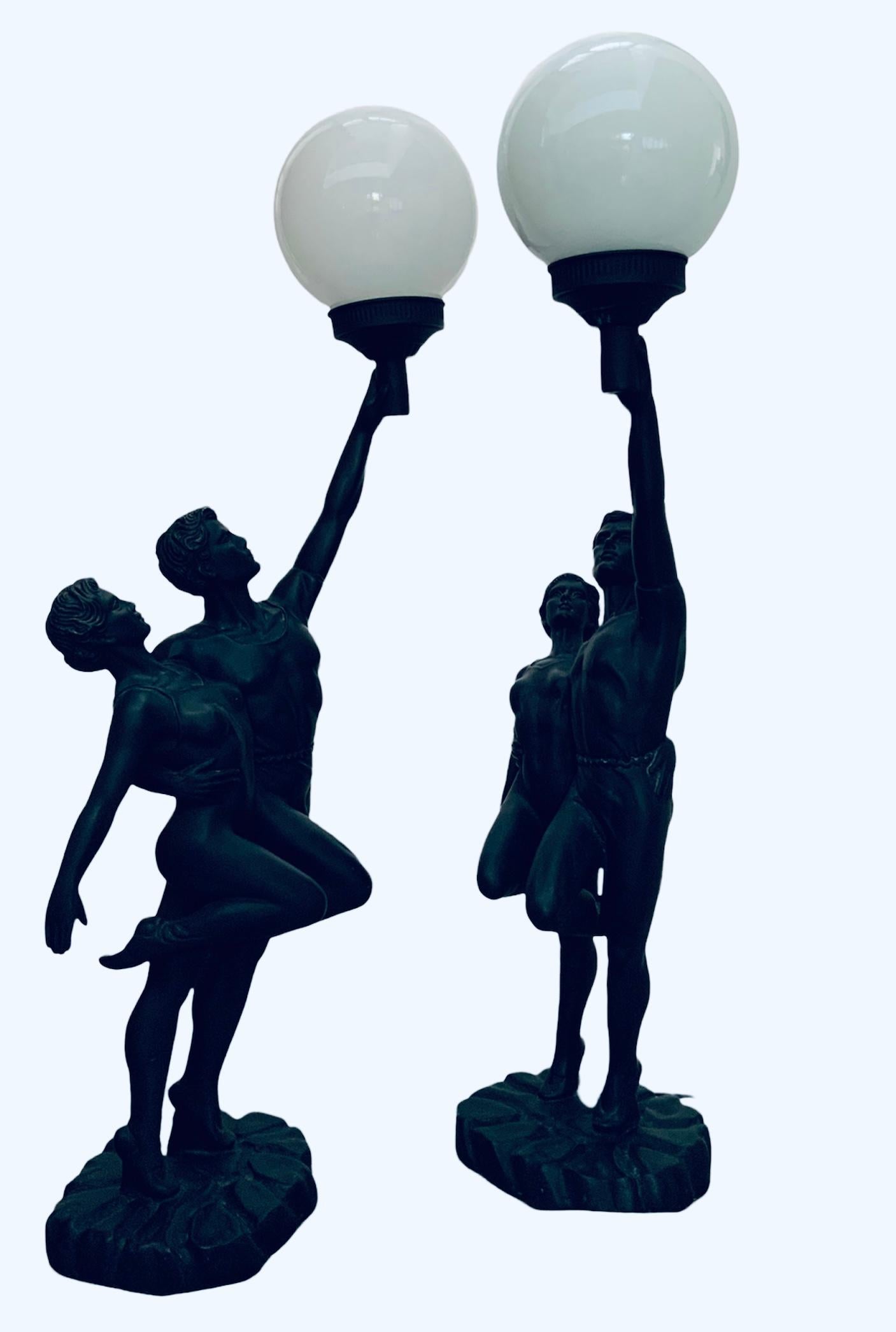 This is a pair of 1993 Crosa resin sculptures of a couple of dancers/gymnasts lamps. They depict a young woman and a young man holding each other in the back in a position to start a dance or a competition. They have a gymnastics or dancer outfit.