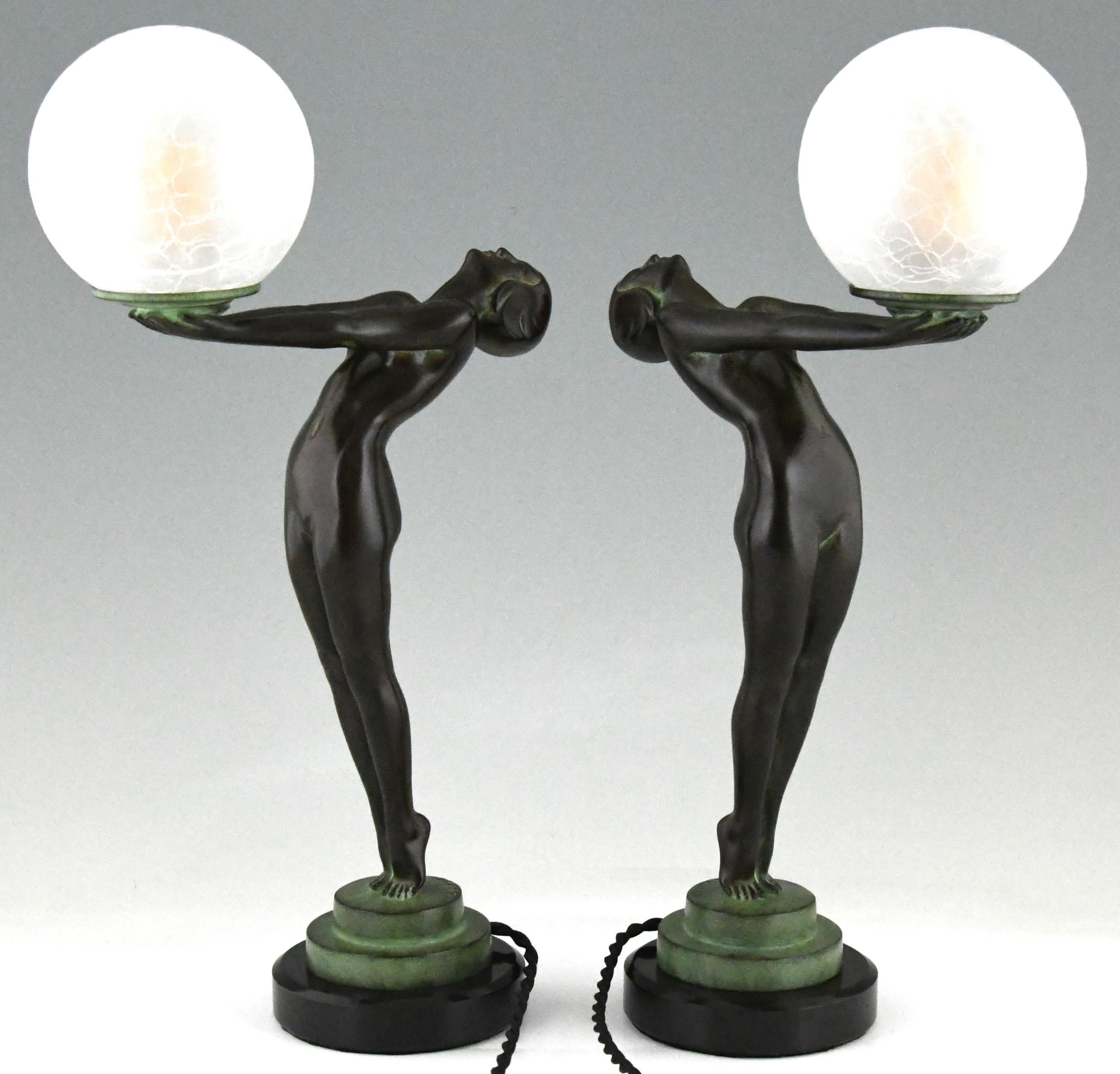 Patinated Pair of Art Deco Style Lamps Clarté Standing Nude with Globe by Max Le Verrier For Sale