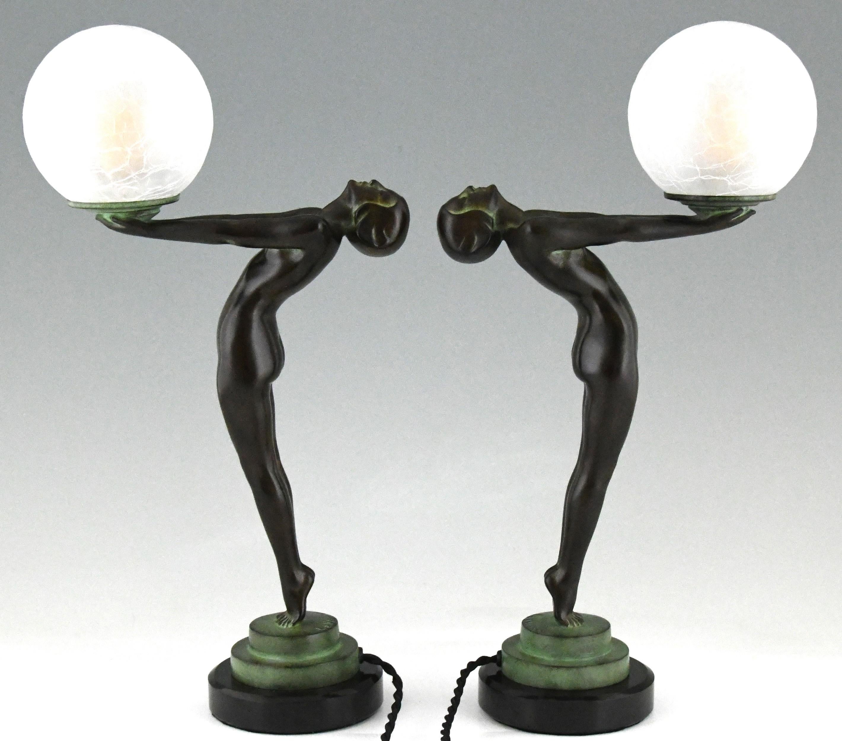 Patinated Pair of Art Deco Style Lamps Clarté Standing Nude with Globe by Max Le Verrier For Sale