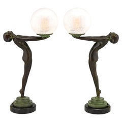 Paire de lampes Art Deco Style Clarté, nu debout avec globe par Max Le Verrier