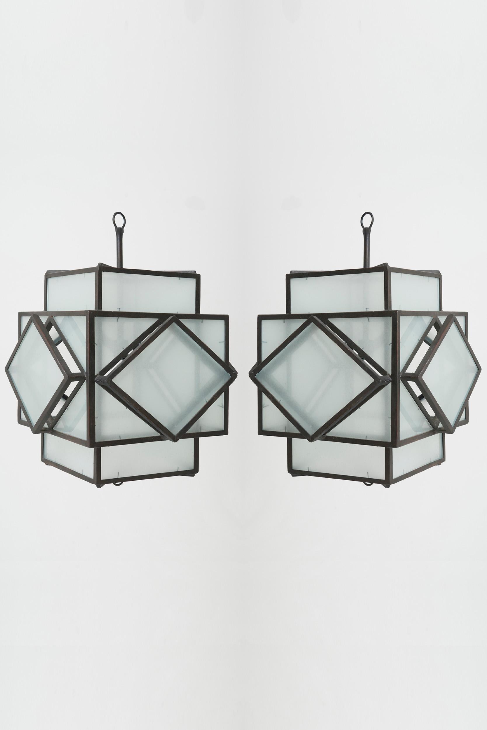 A pair of Art Deco style steel and glass lanterns, in the manner of Francis Jourdain.
Late 20th Century