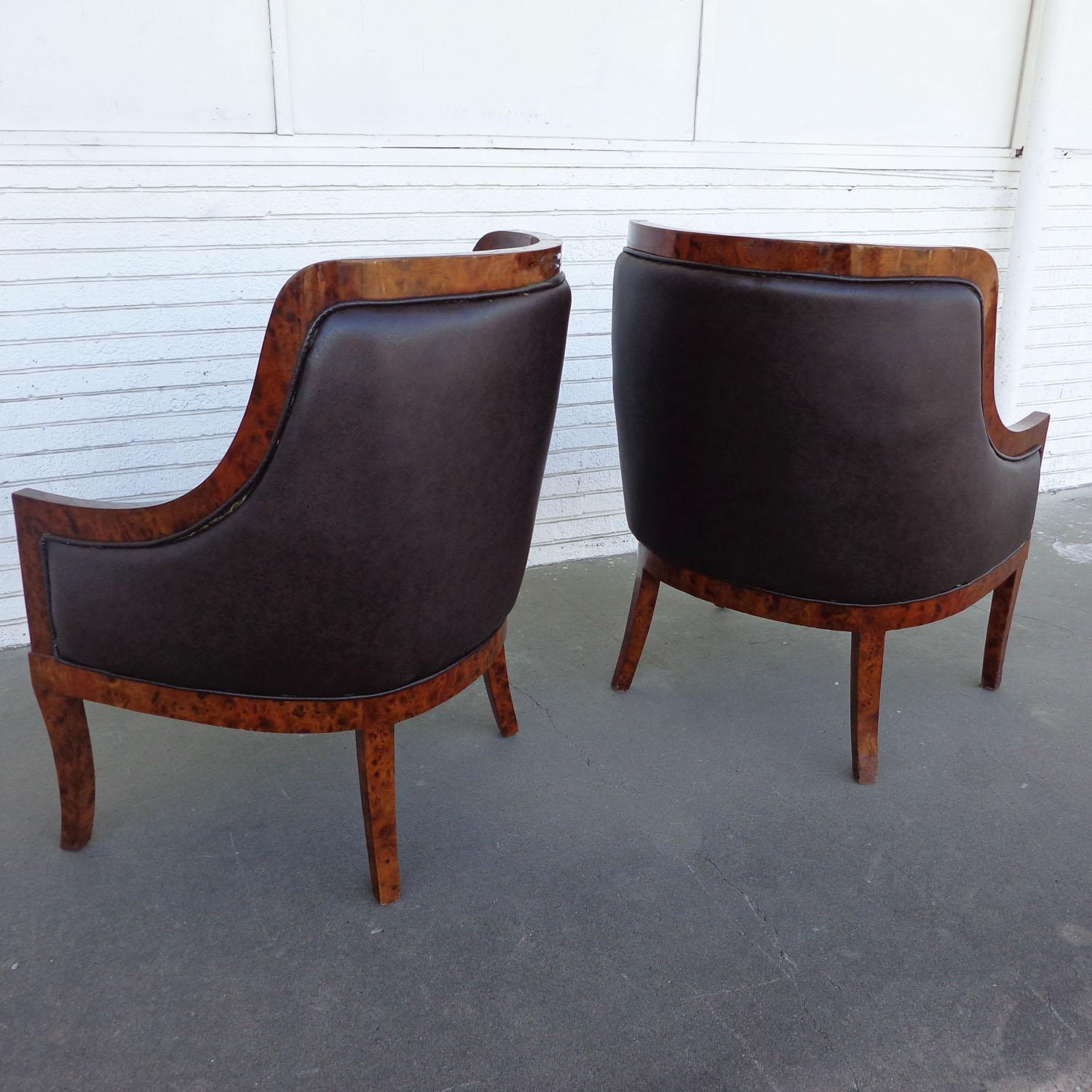 Pair of Art Deco style lounge chairs

Burl framed lounge chairs upholstered in a rich eggplant fabric.

Measures: 31.25 Width x 29.5 Depth x 43 Height
Seat Height 20 
 